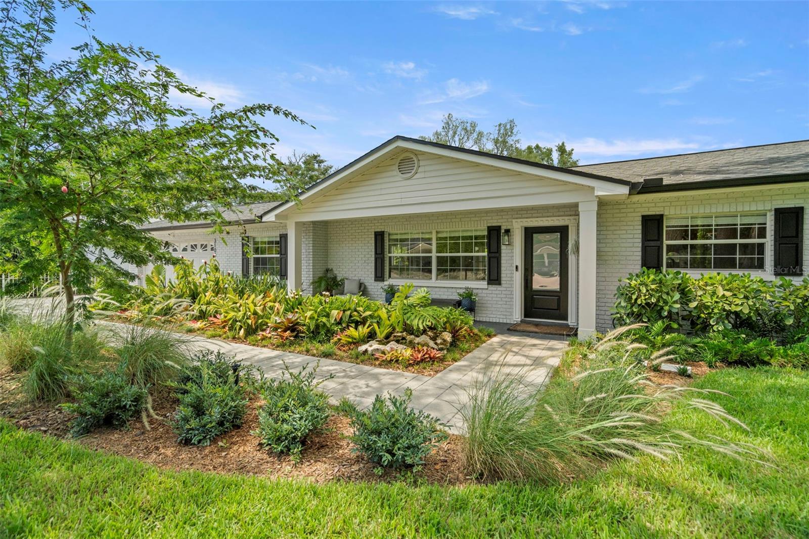 Welcome home to your updated and secluded oasis. This fully renovated 3-bedroom + den/office, 2-bathroom home sits on a lot and a half, near the end of a street for a unique blend of privacy and space just minutes from Tampa's most desirable areas. Only 5-10 minutes from Seminole Heights bars, restaurants, coffee shops, 10 minutes from Carrollwood, 15-20 minutes from the airport, South Tampa, Armature Works, downtown, etc.! Enjoy the quaint, family-friendly neighborhood just blocks from the newly redone Cacciatore Park.
This home offers a fully renovated interior including redesigned kitchen, new den/office, extended master suite, designer bathrooms, new entire house flooring, gorgeous landscaping with automatic sprinklers, aluminum gutters, and outdoor patios. Updated electrical panel includes on-demand water heater and stage 2 smart car charger. Roof, AC and water heater all replaced in the last five years. New cedar garden shed, outdoor shower and play set create the prime environment for enjoying the oversized backyard. Vegetable, fruit and butterfly gardens include various citrus, fig and banana trees, pineapples, strawberries, lemon, lime, kitchen garden, and countless fragrant and exotic flowers. Enjoy your morning coffee or evening glass of wine from the vaulted ceiling enclosed back patio or the terrace-covered garden area out back. Tour this beautiful home today while it lasts!