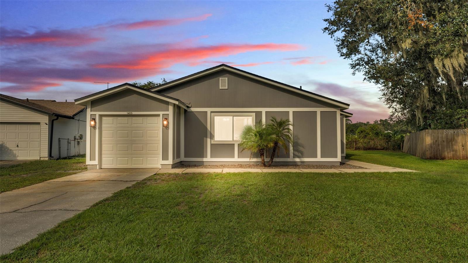 This adorable and cozy house is ready for you to call it your new home! Loaded with updates, you will feel at ease knowing this house is move-in ready! New Hardie board siding was installed in 2024, and the exterior of the house was freshly painted for lasting curb appeal. Upon entry you will love how bright and open the space is. Featuring an inviting vaulted ceiling and ceiling fan in the living room, this house ensures you will always feel comfortable in your home and that your guests will always feel welcomed. Enjoy the hurricane-rated windows, sliding doors, and french doors that were all installed in 2022. The large bay windows offer wonderful extensive views of the side yard and fire pit. You can take pleasure in having meals with loved ones, while appreciating the view of the outdoors. Major improvements include: NEW ROOF 2025, AC 2019, WATER HEATER 2025, cabinet doors in kitchen 2025, and newer garage door and garage door motor. Each bedroom is generously sized and all feature an already installed ceiling fan. The primary bedroom features a huge walk in closet and an en-suite bathroom that offers new tile in the shower and an LED mirror. Step outside to the partially fenced backyard, complete with a fire pit, ideal for relaxing evenings and entertaining friends and family. This house is conveniently located within walking distance to the community playground, making it perfect for families and outdoor enjoyment. If you're a fishing enthusiast, you will also appreciate the serene pond, perfect for relaxing days spent fishing or simply soaking in the view! With modern upgrades already in place and a welcoming layout, this house is ready for you to call it home!
