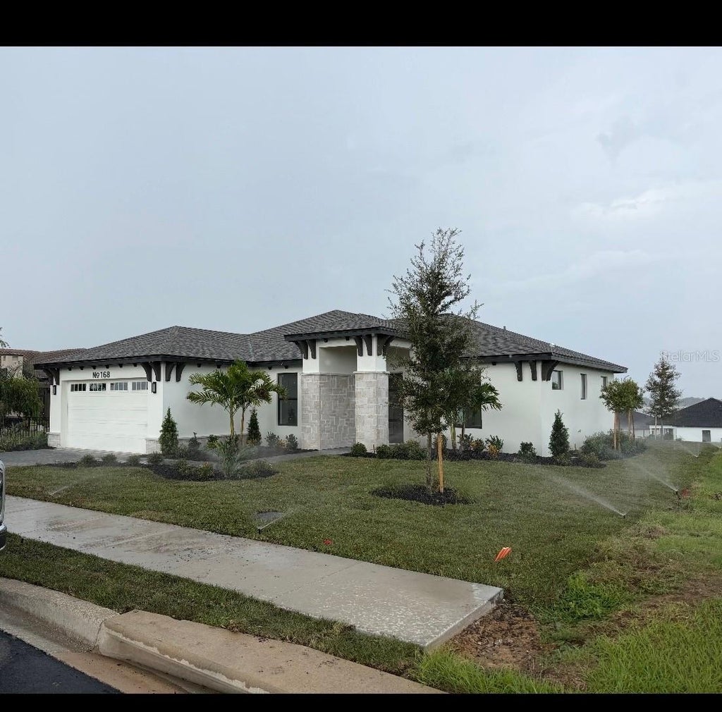 Photo of 168 Fringe Tree Dr, Lake Alfred, FL 33850 (MLS # O6397725)