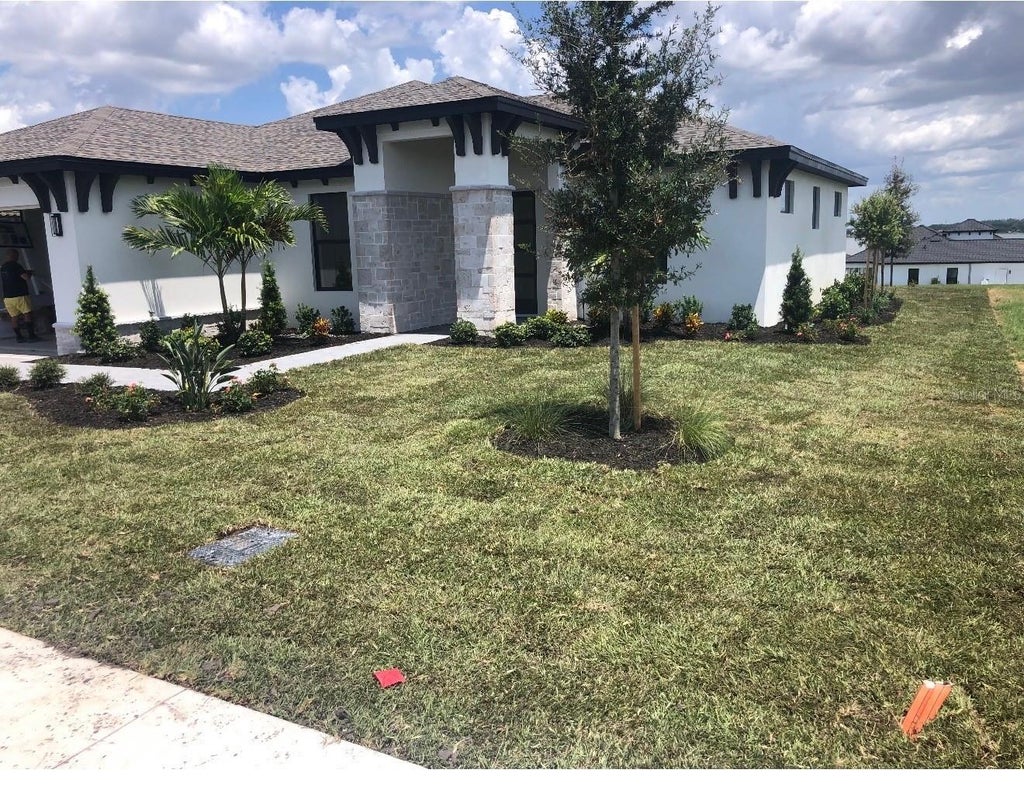 Photo of 168 Fringe Tree Dr, Lake Alfred, FL 33850 (MLS # O6397725)