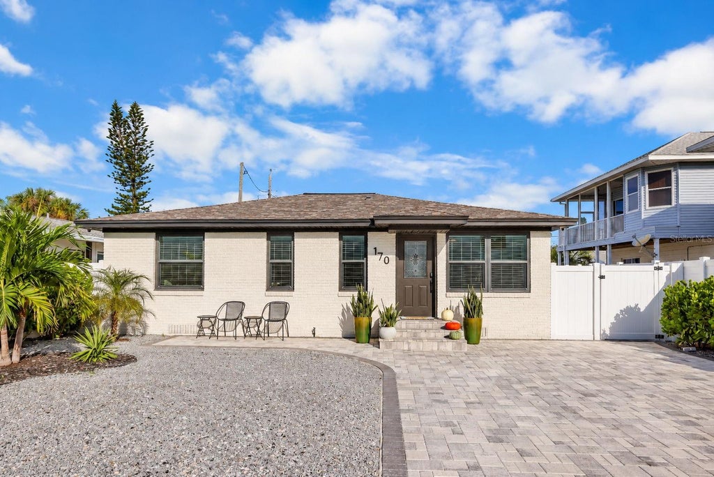 Photo of 170 145th Avenue E, Madeira Beach, FL 33708 (MLS # TB8552862)
