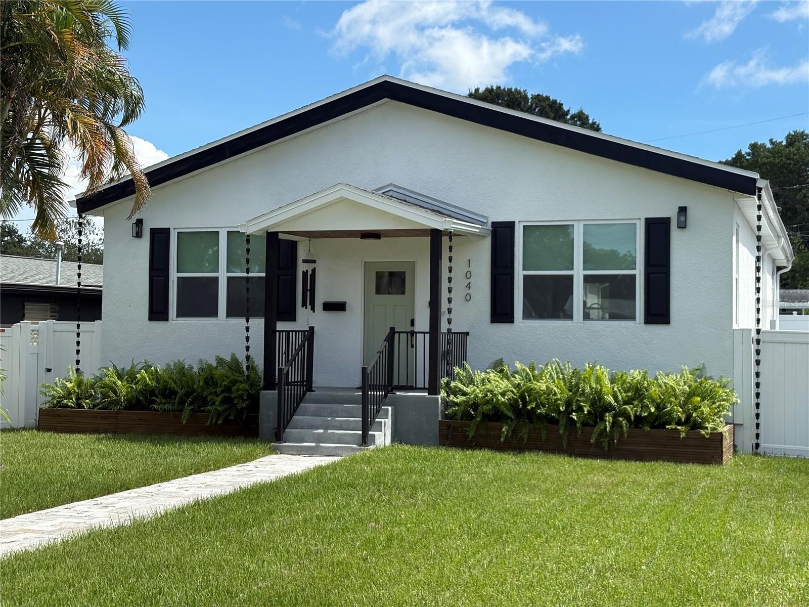 Available starting Sept 11, 2025! More pictures coming soon. Welcome to your 2024 constructed dream home in the highly desired neighborhood of Ravenswood in the heart of St Pete. Upon entering you will be wowed by the huge open concept kitchen/dining/living room with vaulted ceiling reaching 13 ft in height, perfect for entertaining. The kitchen is a chef's dream with a massive island, quartz countertops, white shaker cabinets, wine fridge and a hot water pot filler above the stove. Ceramic tiles flow beautifully throughout the house with a modern wood look. The home comes with an indoor laundry room equipped with brand new washer & dryer. Enjoy private cookouts on the back deck with a fully fenced in backyard. The 1 car attached garage is off the rear of the house with a private back alley to access where your trash and recyclables are collected regularly by the city of St Pete. Street parking is allowed in this neighborhood as well. This home is not in a flood zone so have peace of mind knowing you're safe from floods. This home is perfectly located close to highway access, 4th street & just a short 10 minute drive to downtown. Schedule a showing today before it's too late!