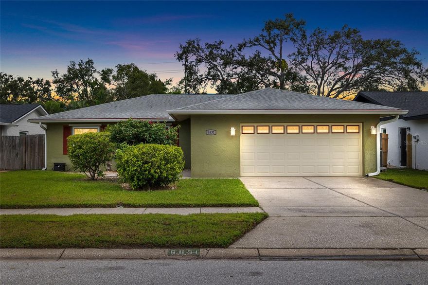Pride of ownership shines in this beautifully maintained 3 bedroom, 2 bathroom, 2-car garage home situated on an oversized lot in a quiet neighborhood with a low HOA of only $35 per year. Owned and cared for by the same family for over 30 years, this property has never experienced flooding and sustained no damage from the past two major storms. The backyard offers serene freshwater canal frontage, with the property line extending past the canal, providing a peaceful setting where you can enjoy kayaking, paddle-boarding, or simply watching turtles and other wildlife. Inside, the kitchen was updated in January 2025 with stunning Brazilian granite countertops, and the master bathroom features a Brazilian granite vanity. The home offers laminate flooring throughout, heavy-duty double-pane windows and sliders with hurricane shutters, a new dishwasher (2025), and a washer and dryer that convey. Additional highlights include exterior paint completed approximately five years ago, rain gutters, a fully fenced yard, and lush landscaping with a mature coconut tree. Located less than 1 mile to Pinellas Park Middle School and just minutes from shopping, dining, and the Gulf beaches. Looking to just move in and settle? This is the home for you.