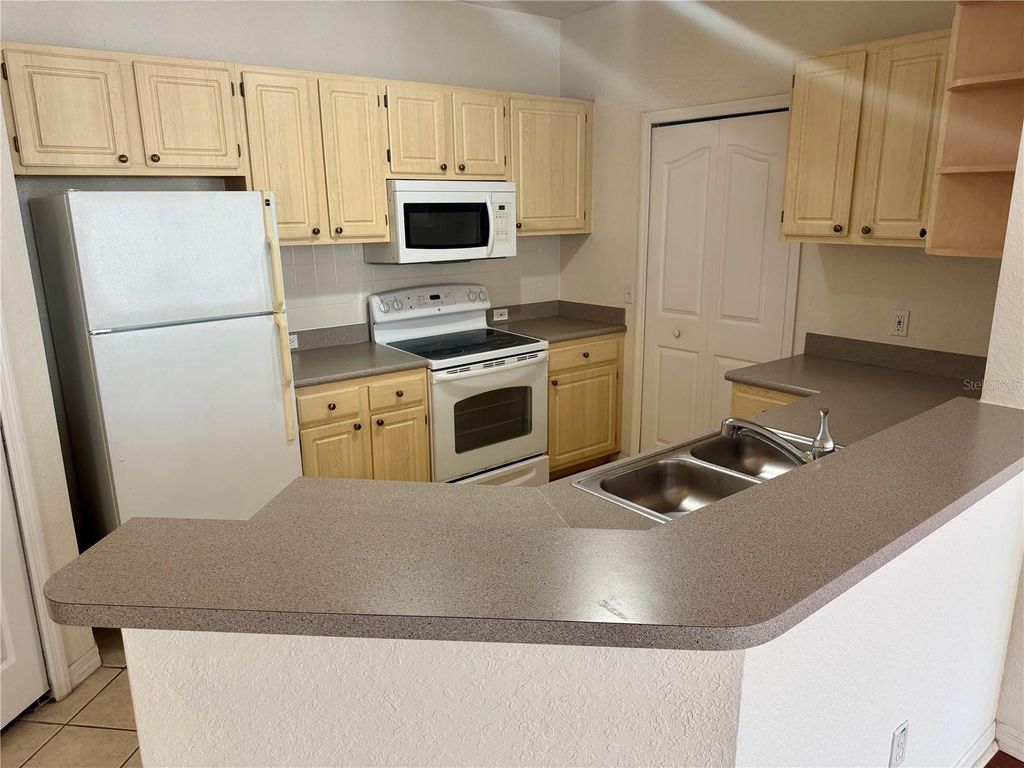Photo of 2740 Maitland Crossing Way #201, Orlando, FL 32810 (MLS # O6406775)