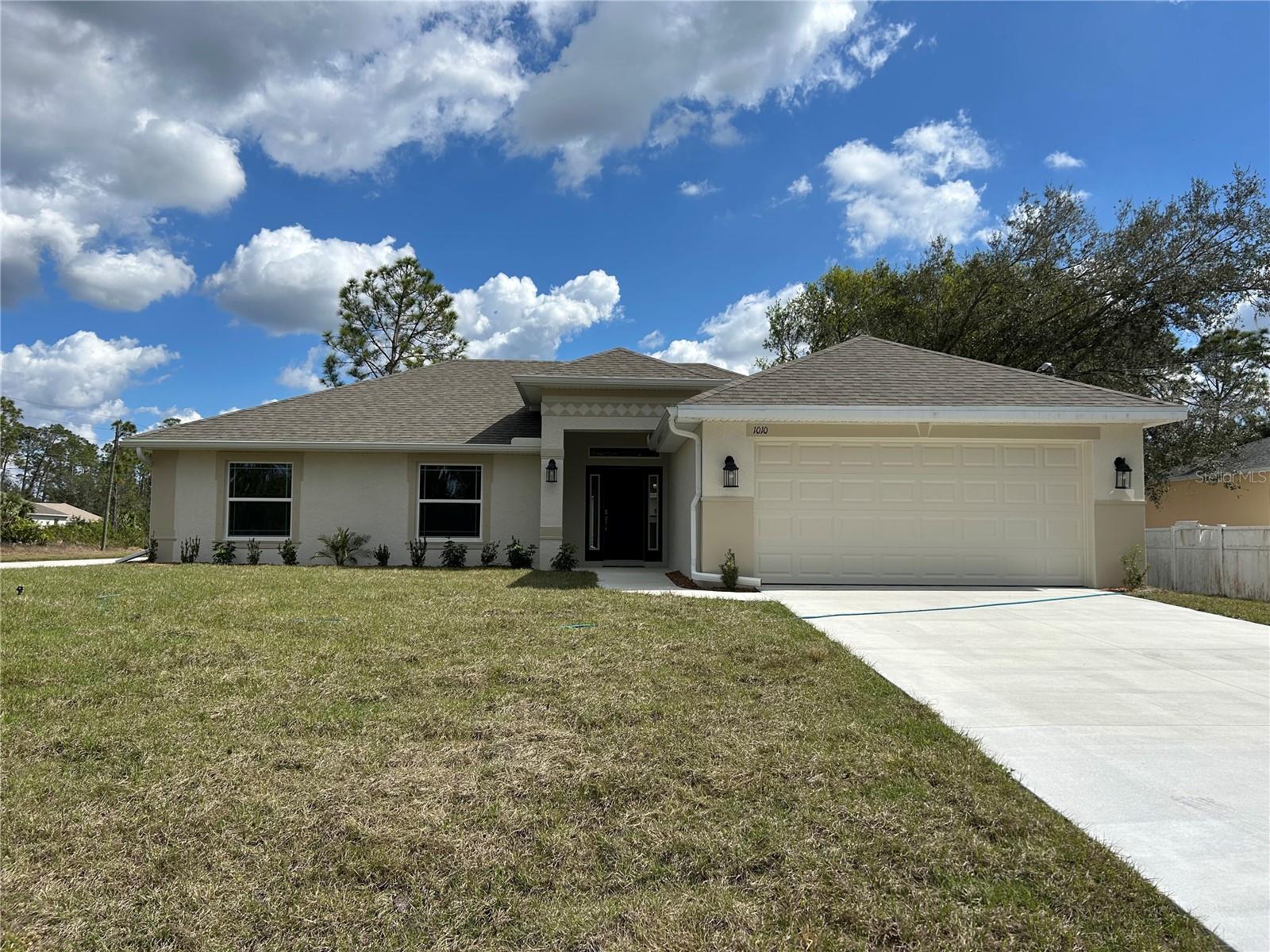 Under Construction. MOVE IN READY!! This is your opportunity to own a wonderful, brand new home with no HOA or CDD fees! Located on an oversized corner lot! One of our most popular floorplans, this home features 3 bedrooms, a den/study and 2 full bathrooms. Thoughtfully designed with an open feel that is perfect for entertaining, while the split floorplan still provides plenty of privacy. Upgraded tile throughout the home except for in the bedrooms. The owner's bath features a garden tub and a separate tile shower! This home also includes a one year workmanship warranty, 2 year systems warranty and 10 year structural warranty.
