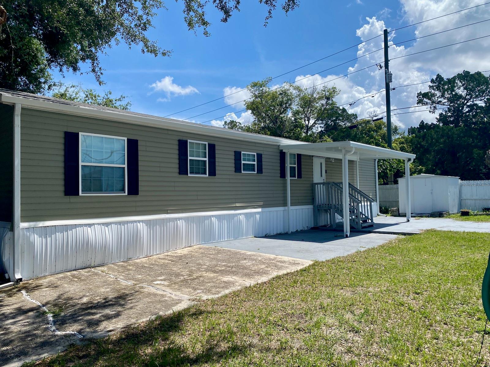 Welcome to your perfect Florida retreat! This well-maintained 2-bedroom, 2-bath split-plan home offers approximately 800 sq. ft. of smart, functional living in the peaceful and pet-friendly community of Sunshine Park—where you own the land and there's no HOA or lot rent!
Enjoy your morning coffee or dinner under the stars beneath the covered portico—perfect for grilling and outdoor dining. The oversized fenced yard offers RV parking with full hookups, making it ideal for guests or your own travel adventures. With appliances, washer/dryer hookups, and updated features like newer gutters and roof, this home is truly move-in ready. It's also an excellent investment as a seasonal rental or a snowbird escape.
The true split-bedroom layout provides privacy and flexibility, and best of all, the property sits high and dry in a non-flood, non-evacuation zone—with no storm damage from last year’s hurricanes.
Tucked away in a quiet area of New Port Richey, you're just minutes from daily essentials like Winn-Dixie, hardware stores, the post office, a local Harley shop, and more. Quick access to US-19, SR-54, SR-52, and the Suncoast Parkway puts beaches, golf, and both Tampa International and St. Pete-Clearwater airports within easy reach.
And for those who love local charm, downtown New Port Richey offers a vibrant mix of unique shops, cozy restaurants, and welcoming bars in a walkable, historic setting. Spend your weekends enjoying Sims Park on the Cotee River, browsing vendors at the farmers market, or soaking up the fun at the Chasco Fiesta, a beloved annual celebration of music, food, and culture.
Outdoor enthusiasts will appreciate easy access to boating, kayaking, and fishing along the river and nearby Gulf coast, as well as hiking and wildlife viewing at Jay B. Starkey Wilderness Park and Anclote Key Preserve State Park.
Whether you're escaping the northern winters, looking for a rental investment, or ready to settle into your own slice of Florida sunshine—this one checks all the boxes. Come take a look and fall in love!
