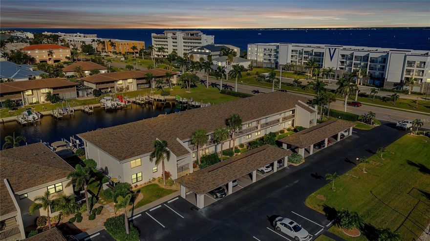 Welcome to Bridge Point Condominium Complex located in Punta Gorda Isles. Great investment opportunity to own a ground floor unit with 2 bedrooms/2 bathrooms and a great view of the canal. Park your motor boat in the deeded boat slip with a lift directly behind your unit with quick access to the Harbor. A great location as your minutes away from Fisherman’s Village, Visual Arts Center, Historical Park, Military Museum, and Dog Park.
This split floor plan allows privacy for your guests. Equipped with an open kitchen area with a breakfast bar. The kitchen has a reverse osmosis system. The water heater has been recently replaced and up to code. AC was replaced in 2017 and has been inspected and in good working order. Plumbing in half bath was recently replaced along with new drywall installed. Inside laundry room with full size washer and dryer. This unit is ready for you to put your finishing touches on it and make it your own and comes with a covered parking spot. 
The heated pool has a large deck area with plenty of seating, bathroom facilities along with a gas grill where you can attend community Pot Lucks. 
This complex has tennis/Pickle-ball courts along with shuffleboard.
Close to downtown Punta Gorda, shopping, parks, restaurants, golf courses, and Punta Gorda Airport.