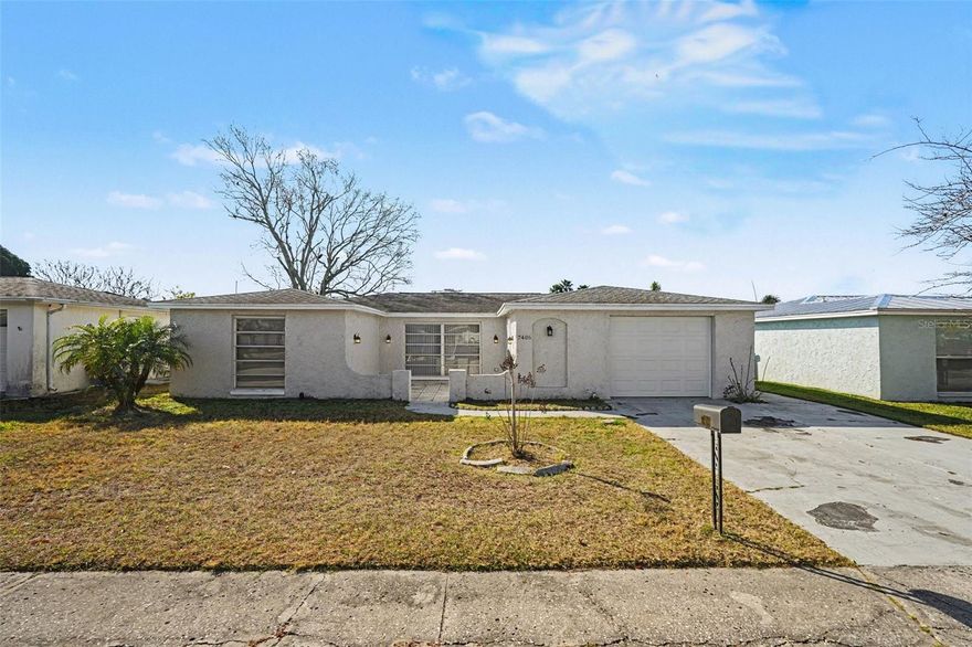 This 3-bedroom, 2-bathroom home offers a rare opportunity for serene, waterfront living, positioned directly on a lot that borders a picturesque lake. The stucco exterior provides a clean, modern look, while the interior is completely move-in ready, boasting architectural details like vaulted ceilings and skylights that flood the space with natural light. The open and airy layout is designed to maximize the tranquil views, creating a seamless connection between the bright living areas and the stunning lakeside setting. Whether you’re relaxing under the high ceilings or enjoying the water breeze from your backyard, this home serves as a perfect, turn-key sanctuary.