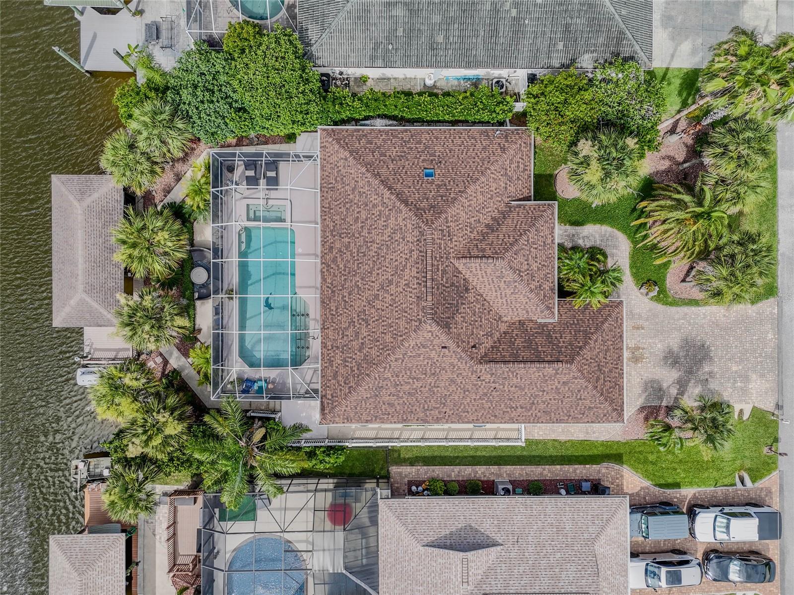 Welcome to this absolutely stunning saltwater canal pool home — a true boater’s dream, now available for rent! The extended paver driveway leads you through lush, tropical landscaping. Inside, you’ll be greeted by captivating views of the pool and canal from the spacious living area with vaulted ceilings. The chef’s kitchen is fully equipped with top-of-the-line appliances and offers bar-top seating for four, perfect for cooking and entertaining. The master suite features beautiful hardwood floors, a large walk-in closet, an oversized bathroom with his & her sinks, a walk-in shower, a soaking tub, and direct access to the lanai. Guest bedrooms provide comfort and space, each with large walk-in closets. Step outside to an elevated screened lanai with plenty of room for outdoor living. Enjoy relaxing days in the sparkling screened-in pool and spa — an ideal way to unwind after a day out on the water. Boaters will love the well-appointed boat house with a 10,000 lb lift and durable Trex decking, along with easy and fast access to the ICW. Don’t miss the opportunity to lease this fully furnished waterfront retreat! Palm Coast offers quiet living with easy access to major cities; 30 minutes to St. Augustine or Daytona Beach, 60 minutes to Jacksonville, 80 minutes to Orlando.