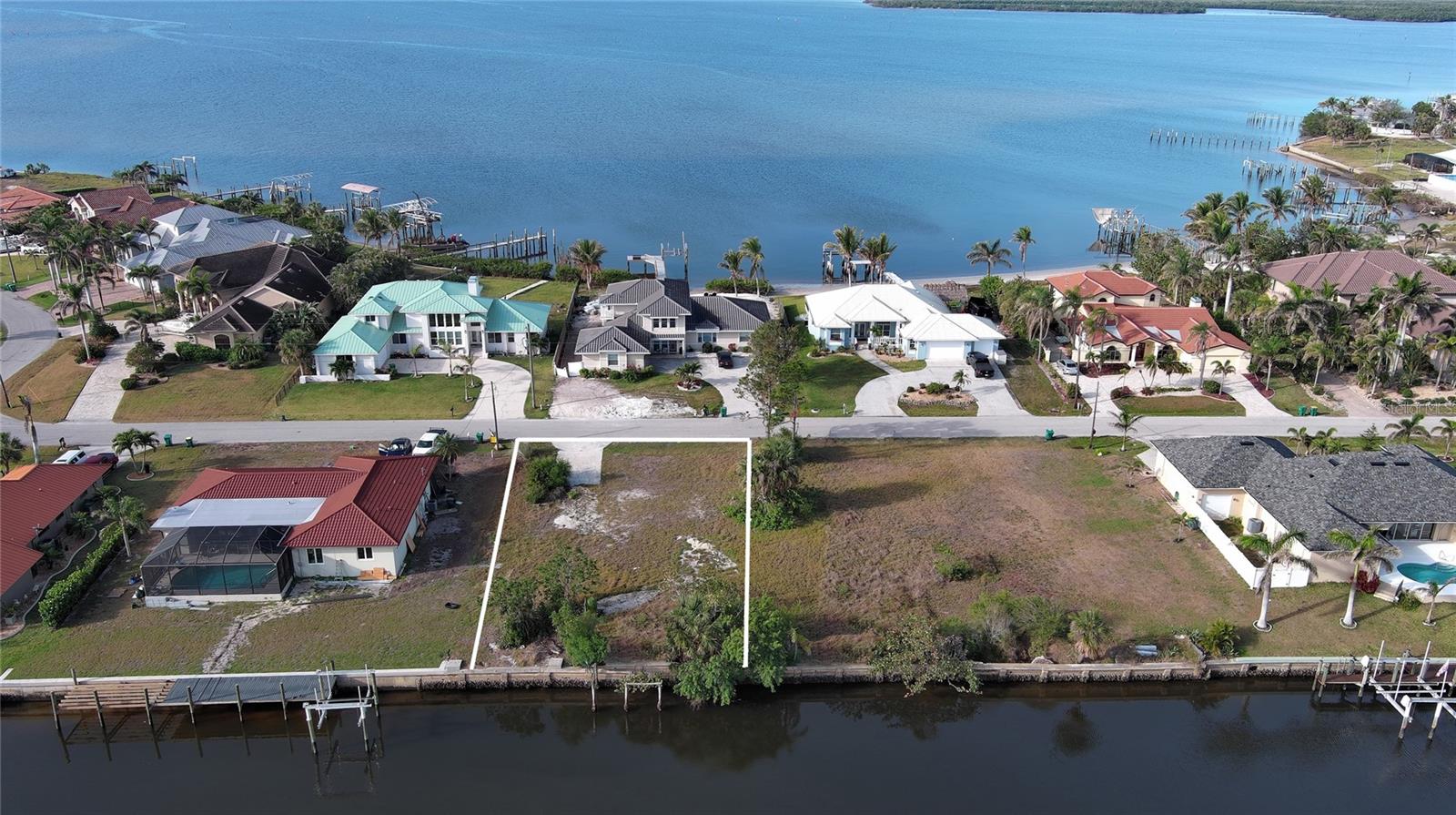 Come and build your dream home on this 100' x 125' canal lot. Beautiful 70' wide deep water canal only 5 minutes from Charlotte Harbor and approximately 12 miles from the Gulf of America. Nearby on Harbor Blvd, a new pool, meeting facility and waterfront park is in the works.