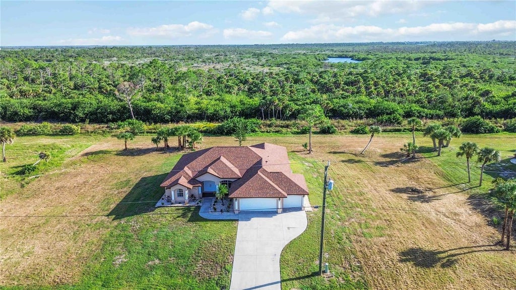 Photo of 1159 Boundary Boulevard, Rotonda West, FL 33947 (MLS # D6149454)