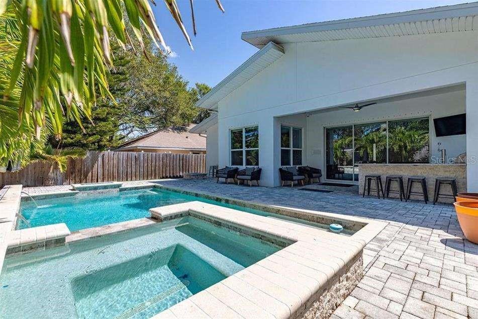 Super MODERN 5 BR SMART house w/ POOL, Outdoor Kitchen, Media Room, Steam Shower and much more. Kitchen with all Viking appliances and wine fridge. House is Partially furnished (negotiable) - Theater seating in media room, and home office. 10 TVs mounted throughout the house including 2 weatherproof outdoor TVs. Alarm system, in ceiling speaker system thought-out house and backyard. Automatic shades on windows. Backyard fully furnished, 2 glass fire pits, kegerator, fridge, gas grill, artificial turf, and pool. Minutes to Bayshore, SoHo, and downtown via Selmon Expressway. "Owner is a licensed real estate agent in the State of Florida."