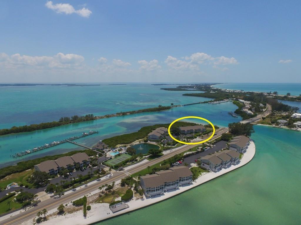 Bay front first floor Boca Grande North condominium with Marina and Intracoastal water views! This is a 2 bed, 2 bath, 1,247 sq. ft. unit. There is a private balcony off of the guest bedroom and direct access off the rear screened lanai. Boca Grande North offers you a secure gated community, heated swimming pool and spa, tennis court, outdoor BBQ grills, on-site management sales and rental office, private beach with sun deck and boat docks are available for lease or purchase.