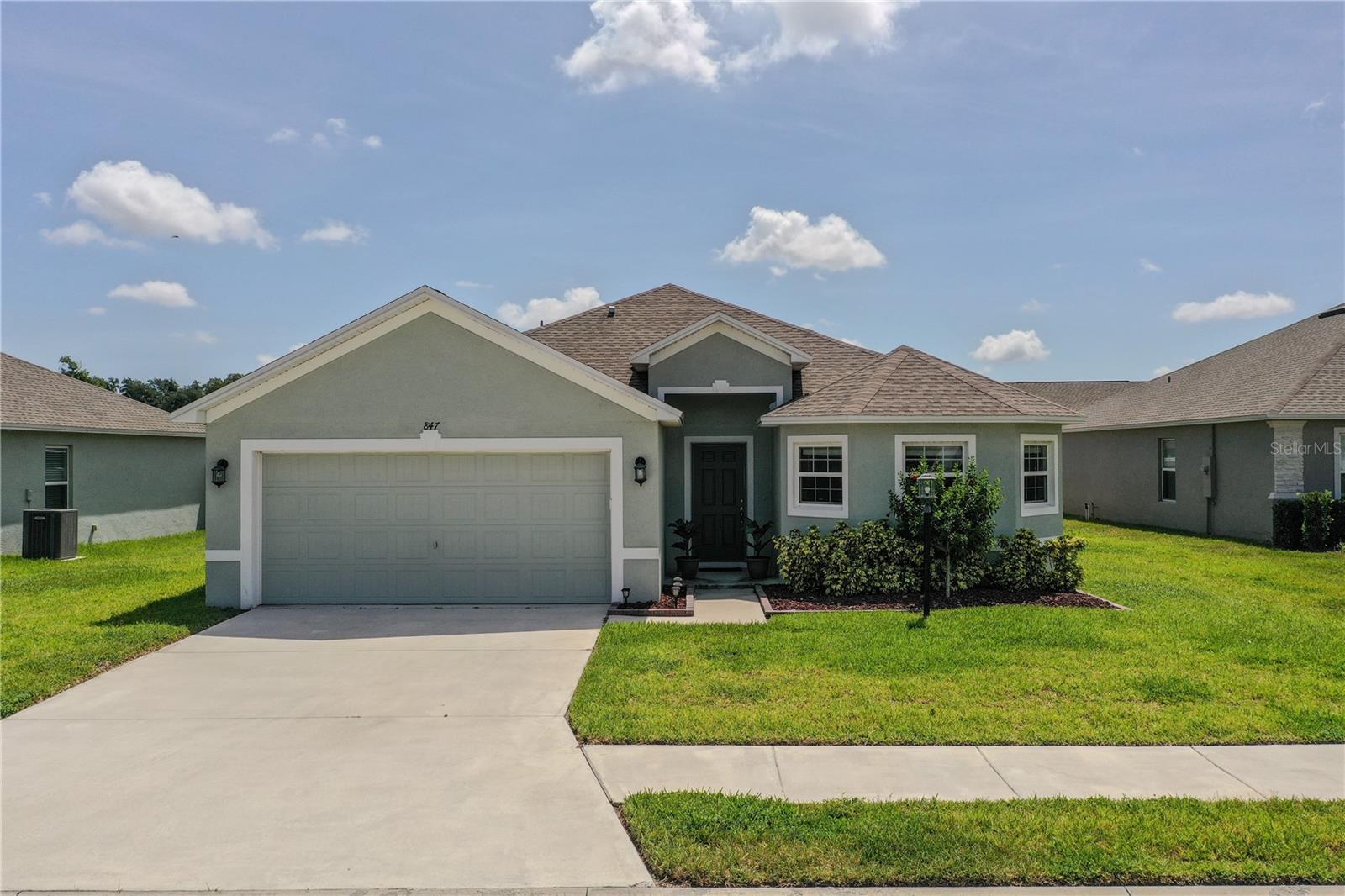Welcome to your perfect retreat in this exclusive gated community, where tranquility meets convenience! Enjoy easy access to shopping, dining, and the exciting attractions of Winter Haven, including Legoland Theme Park, all just minutes away. This charming three-bedroom, two-bathroom home features a modern open-concept layout and a split bedroom design for added privacy. You'll love the luxury vinyl flooring throughout the living areas, with cozy carpet in the bedrooms. Step outside to your large, fully fenced backyard—perfect for relaxation without any rear neighbors. Unwind in your spacious screened-in lanai, ideal for enjoying the outdoors year-round! Additional highlights include an 8 x 5 fireproof storage closet in the garage, providing peace of mind for your valuables, as well as a well-maintained irrigation system and beautiful landscaping that enhances the curb appeal. With quick access to the Polk Parkway and Interstate 4, Central Florida adventures are at your fingertips. Don’t miss out on this fantastic opportunity—schedule your showing today!