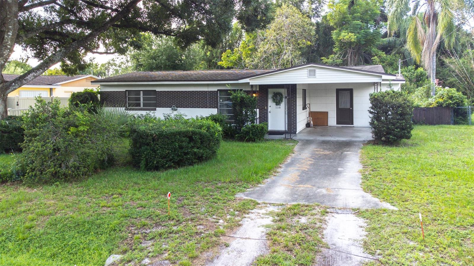 Welcome to this cozy and well-located 2 bedroom, 1-bath home just minutes from the heart of downtown Tampa. Roof (2016) - (A/C 2019) - (Electric Panel 2023) - (Water Softener 2023). Nestled on a quiet, tree-lined street, this property offers the perfect blend of comfort and convenience. Inside, you'll find a functional layout with plenty of natural light. Terrazzo floors lie beneath the existing carpet - just waiting to be restored to their original mid-century charm. The home offers great bones and endless potential for customization, whether you're a first-time buyer, downsizing, or investor. The living spaces flow seamlessly into a spacious, screened-in back porch, perfect for relaxing or entertaining year-round. Enjoy easy access to Tampa's vibrant downtown, Armature Works, Riverwalk, major highways, shopping, dining, and entertainment - all while coming home to a peaceful, established neighborhood.