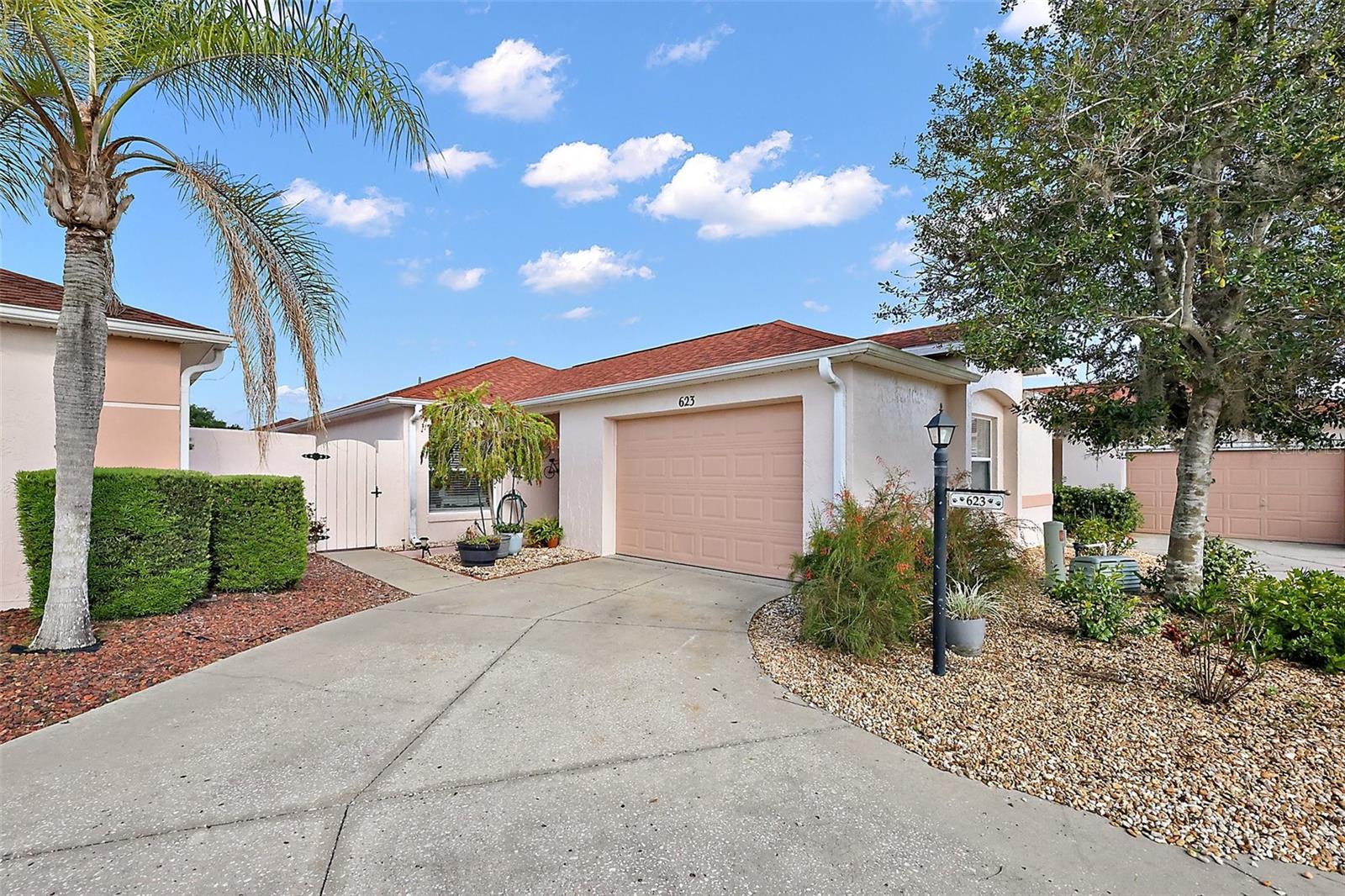 BOND PAID. Upgrades GALORE! Welcome to the RARE move in ready Courtyard Villa in de la Mesa. All 139 well maintained Villas share ownership of a PRIVATE PARK & POOL!
Big UPDATES boast a 2025 ROOF, 2021 A/C, 2020 Hot Water Heater, 2021 Gorgeous Continuous LVP flooring, Carpet-free, 2023 Awnings and NO POPCORN!
2021 Remodeled Kitchen: Granite/ soft-close cabinets, Stainless Appliances.
2021 Remodeled Baths: Granite/new cabinetry/new glass shower and bath/shower combo./fixtures/mirrors & lighting.
Unwind in you tiled, A/C and Heated Lanai which btw adds 112 sf !
Relax in your shady outdoor patio with your favorite beverage and no grass to mow as you look up for Launching...Take a leisurely stroll on the path in your private park.. very serene...amongst Palm Trees, chirping birds, lush shade trees, beautiful vegetation and the great smell of the communal herb garden. Along the way you'll pass the salt water heated pool, Gazebo, hot and cold shower and men and ladies bathrooms. Or get ready for Games on Sunday, Cards on Tuesdays, Bingo, Happy Hour on Fridays, Trivia, BBQ, Pot luck parties and lots of community activities if you wish.
The garage comfortably holds a car and a golf cart and is complete with a new garage door opener and automatic screen!
Walk or ride to nearby Spanish Springs and to Sumter Landing only a little over 2 miles away. Houses of Worship/Restaurants/Gym/Shopping/Entertainment are very close.
Entertainment in The Villages is 365 days a year (weather permitting) in the Squares and nearby eating establishments. The Villages are known to have more holes of golf than anywhere! Over 3000 clubs. The largest American Legion in America is nearby...go play Queen of Hearts on Tuesdays! There is easy access to top tier shopping, delicious restaurants and Country clubs and a variety of Medical facilities including The Village Hospital and The Veteran's Administration ! A modest HOA ensures grounds and pool upkeep and also includes painting outside fronts of homes every few years at no additional charge to homeowners.