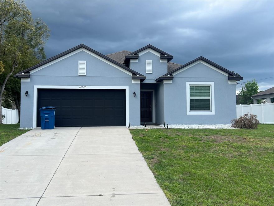 Welcome to this beautiful newer construction home in the heart of Spring Hill. Built in 2022, this spacious residence provides plenty of room for comfortable living and entertaining. Step inside to discover a bright and open floor plan featuring large tile flooring in the main living areas, generous natural light and a modern layout designed for today's lifestyle.  The kitchen opens seamlessly to the living and dining area, making it perfect for gatherings and everyday living. The split bedroom layout provides privacy for the primary suite, while the additional bedrooms offer flexibility for family, guests and a home office. Current owners updated the master bedroom shower, toilets, added a built-in home theater system, a custom built in wine display wall, perfect for showcasing a wine collection and adding a sophisticated focal point to the home. The backyard is also upgraded by enclosing it into a screen-in porch, creating the perfect space to relax, entertain, and enjoy Florida living.