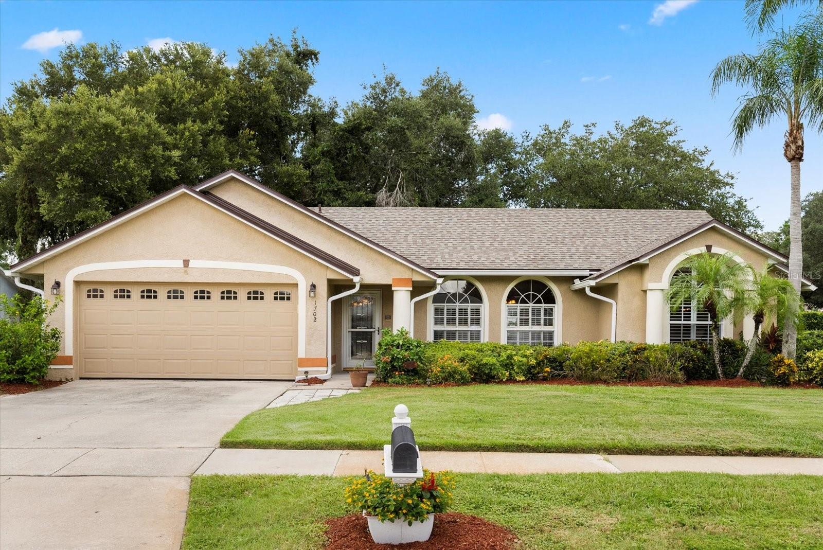 **This property qualifies for a closing cost credit up to $7,400 through the Seller’s preferred lender.**Nestled on a spacious corner lot, this beautifully updated 4-bedroom, 2-bathroom pool home offers the perfect blend of style, comfort, and functionality. Step through the front door into the elegant formal living room, where natural light pours in, setting the tone for the rest of the home. To the right, discover the luxurious primary suite featuring a stunning arched window with plantation shutters. The ensuite bath is a true retreat with a double sink vanity, soaking tub, and a glass-enclosed dual-head shower for the ultimate spa experience with private access to the pool. The heart of the home is the open-concept kitchen and family area, boasting granite countertops, stainless steel appliances, breakfast bar seating, and a charming dinette with French doors leading outside. The family room is lined with wall-to-wall windows, creating a bright and inviting atmosphere. Down the hall, you'll find three additional bedrooms and a full guest bathroom, offering ample space for family, guests, or a home office. Step outside to your private backyard paradise: a covered patio extends into a fully screened pool area (newly screened in 2025), complete with solar-heated pool (new panels 2025). Beyond the screen enclosure, enjoy the fenced green space with a vinyl fence and a picket fenced in space for pets, along with a pineapple and herb garden for added charm. Recent upgrades include: new roof (2024), new interior paint (2024), new microwave (2025), new window treatments (2025), reverse osmosis system, and fresh landscaping. Located in a community that has just undergone a major infrastructure upgrade – now fully connected to city sewer with newly paved roads – this home offers peace of mind and long-term value. Don’t miss your chance to own this move-in ready gem with every amenity you’ve been looking for. Schedule your private tour today!