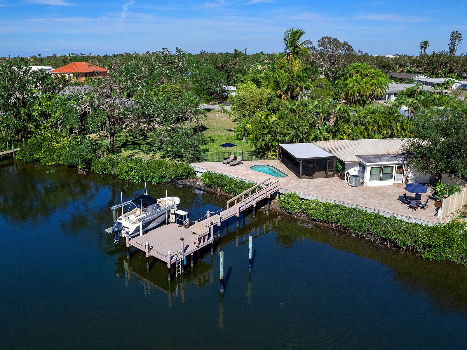 Perfect investment opportunity, close to Siesta Key! Come see this delightful duplex, located on a quiet cul-de-sac street
with wide open southwesterly views of Phillippi Creek. Boaters can reach the Intercoastal waterway in less than a
mile. Or jump in your kayak and head out to Sarasota Bay. The duplex has 119 feet of waterfront with large deck and
pool area. Featuring a 10,000 pound boat lift, Azek dock, and a new seawall. The back unit has gorgeous views and
could be rented out, while the owner lives up front. Or if you are looking for an affordable way to live a boating
lifestyle, you can move in and rent out the front unit. Each two bedroom home has its own electric and water meters
and can be rented either annually or on a month-to-month basis. The units are being sold turnkey furnished, have a
standing seam metal roof and are move in ready. Don't miss out on this centrally located, income producing property.