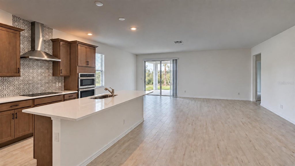 Photo of 1909 Greenborough Loop, Deland, FL 32724 (MLS # O6444940)