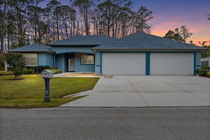 Stunning, upgraded 5-year-old concrete block home in desirable Seminole Woods, perfectly situated on a 0.29-acre corner lot in a quiet cul-de-sac. Enjoy an ideal location just minutes to the beach, AdventHealth Palm Coast, and shopping and dining along SR 100, with quick access to US-1 and I-95.

Inside, an open, light-filled floor plan centers around a chef's kitchen with counter-height bar, sun tunnel, soft-close cabinetry, stone backsplash, farmhouse sink, walk-in pantry, and high-end Café GE stainless appliances. The oversized island and breakfast area are perfect for casual gatherings, while the formal dining room with double doors is ideal for special occasions.

The private primary suite offers a sitting area, walk-in closet, and spa-like bath with jetted tub, dual vanities, tiled walk-in shower, and separate water closet. A true in-law/guest suite with its own full bath, an additional bedroom with half bath, and a flexible 4th bedroom/office provide room for everyone.

..... Car lovers will appreciate the rare 4-car garage with insulated hurricane-rated doors, heavy-duty motors, and epoxy floors. A whole-house 22kW generator with owned 250-gallon in-ground LP tank provides peace of mind.

Quality features include Dade County-rated hurricane doors/windows, solid interior doors, Trane 4-ton A/C, tankless water heater, can lighting and ceiling fans throughout, Levolor shades (blackouts in bedrooms), Ring doorbell, and exterior security lighting.

Step outside to a low-maintenance yard with mature landscaping, irrigation, French drains, LP gas line for a future outdoor kitchen, and abundant storage under a 30-year architectural roof with gutters and guards. Tex-Coat stucco resists fading, peeling, and mildew, so you can simply move in and start enjoying relaxed coastal Florida living.