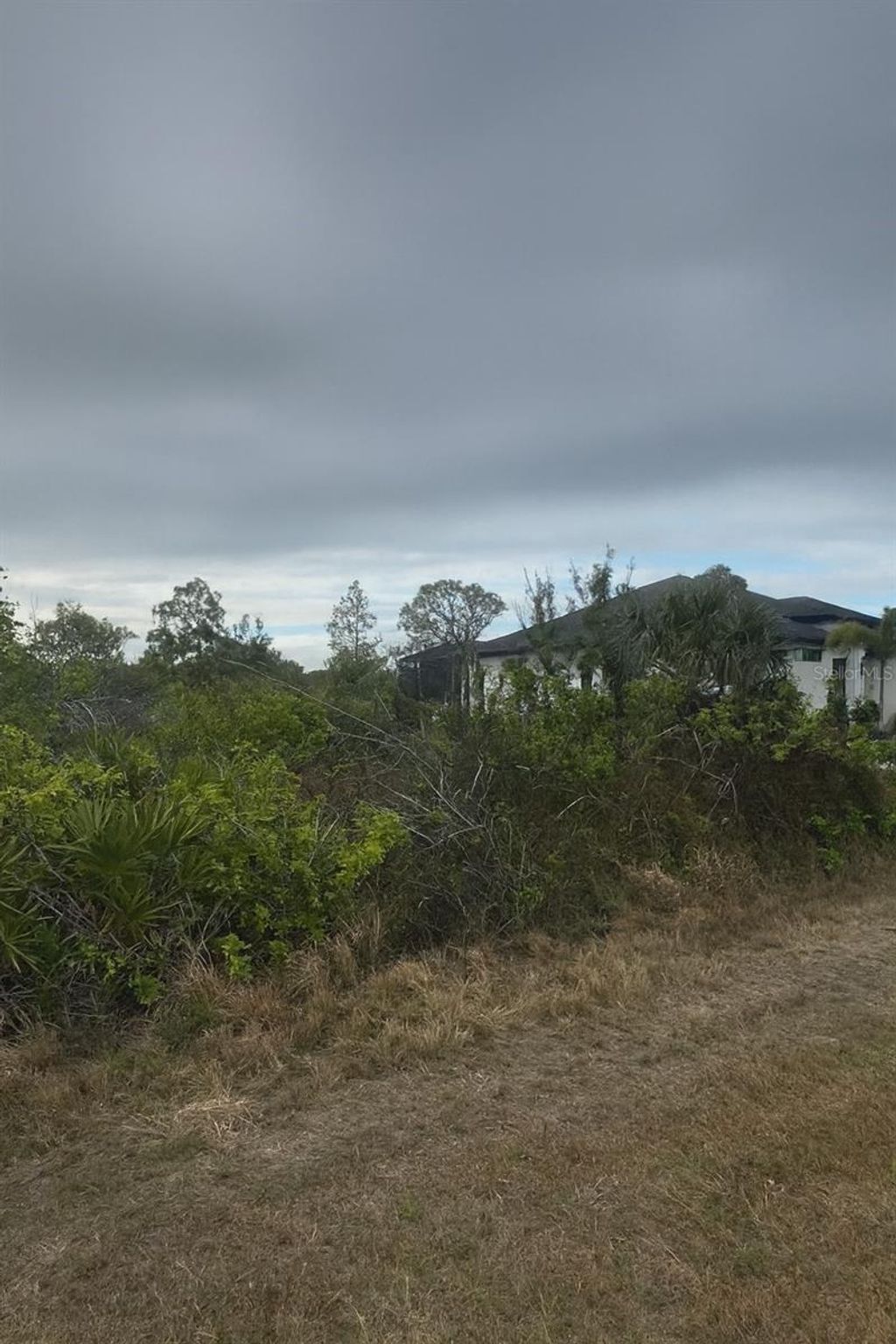 Photo of 9517 Sundance Street, Port Charlotte, FL 33981 (MLS # O6342727)