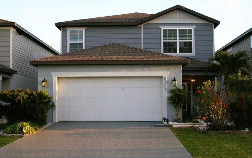 Imagine stepping into your dream home in Parrish; a single-family home boasting four bedrooms, three full bathrooms, and a beautifully completed garden. From the expansive back porch and attached extended terrace, you'll enjoy greenery and serene wood views of the conservation area along with the picturesque landscaping. The spacious entryway and guest room with bathroom greet you upon arrival. The home's cozy living space showcases an open-concept split floor plan, connecting seamlessly to the balcony and attach extended terrace designed with plants for maximum privacy and shade. The second-floor houses three bedrooms and two full bathrooms, along with a laundry room and versatile living space. The owner's master suite features a dual-sink vanity, ensuite bathroom, and master walk-in closet. Recent exterior exquisite landscaping and a one-story layout enhance this property's appeal. Enjoy the screened covered lanai and paved area overlooking the woods, perfect for outdoor activities. Due to the conservation area, there is no neighbors in the back.  The community's Club House, Game Room, Pool, and Playground are additional amenities. With easy access to I-75 and I-275, this residence is minutes from St. Petersburg, Clearwater, Bradenton, and Sarasota. Don't miss this opportunity to own an affordable home in Parrish – schedule a private showing today!