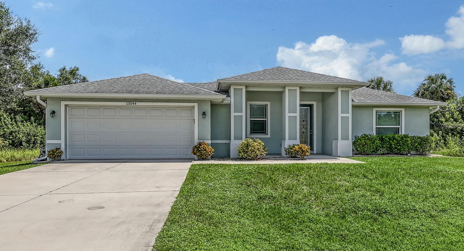 From the moment you step into this home, you will appreciate how well maintained it has been. This (3) bedroom, (2) bath home with 1,538 sq ft of living space, IMPACT WINDOWS, OVERSIZED LOT, and is being offered PARTIALLY FURNISHED, will definitely catch your attention. You will love the open floorplan, split bedrooms and that it is FULLY TILED throughout the home. It is accented with a tray ceiling in both the living room and primary bedroom areas. The kitchen overlooks your main living spaces and has stainless steel appliances, granite countertops, a pantry and an eat-at counter. The primary bedroom is very roomy with walk-in closets, en-suite bathroom that features double sinks with granite counter and a step-in shower. Both additional bedrooms are very welcoming and nice sizes. You will notice that the one is currently set up as a TV/Den area. There is a covered lanai area that looks onto an undeveloped area which offers you additional privacy and serenity in your own backyard. This home has beautiful curb appeal which you will feel proud to own. NO HOA!
You will appreciate that it is not far from shopping, area beaches, golf courses and local restaurants. Don't let this one get away! Schedule your appointment to see. I believe you will like what you see.