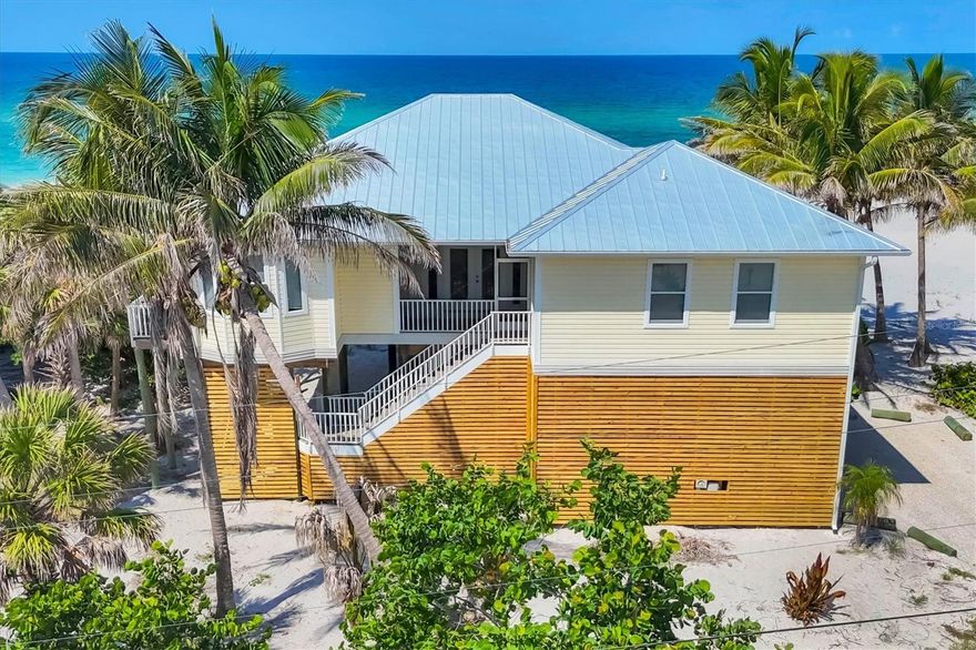 Beachfront Bliss on Don Pedro Island – 100 Ft of Gulf Frontage!
Escape to paradise on this stunning Gulf-front property boasting 100 feet of pristine white sand beach, where seashells and sharks’ teeth are in abundance—and solitude is the norm. Located on the exclusive Don Pedro Island, this 4-bedroom, 3-bath coastal retreat offers one-level living with an open and breezy layout designed for relaxation.

The spacious primary suite features an en-suite bath and direct access to a large screened porch, the perfect place to unwind and take in panoramic sunset views over the Gulf of Mexico. Soak in the island lifestyle from your lower sun deck, where swaying coconut palms and the sound of the surf create a tropical escape made for steel drums and piña coladas.

Upgrades include a newer standing seam metal roof, hurricane impact-rated windows and doors, new septic tank, and an elevator shaft wired and ready for installation. A 3' easement across the street provides access to Bocilla Lagoon—perfect for kayaking and exploring the serene backwaters.

Don Pedro Island offers the ultimate in Old Florida charm: few cars, no crowds—just peace, privacy, and natural beauty. Accessible only by boat or car ferry, this island sanctuary is Florida living at its finest.
