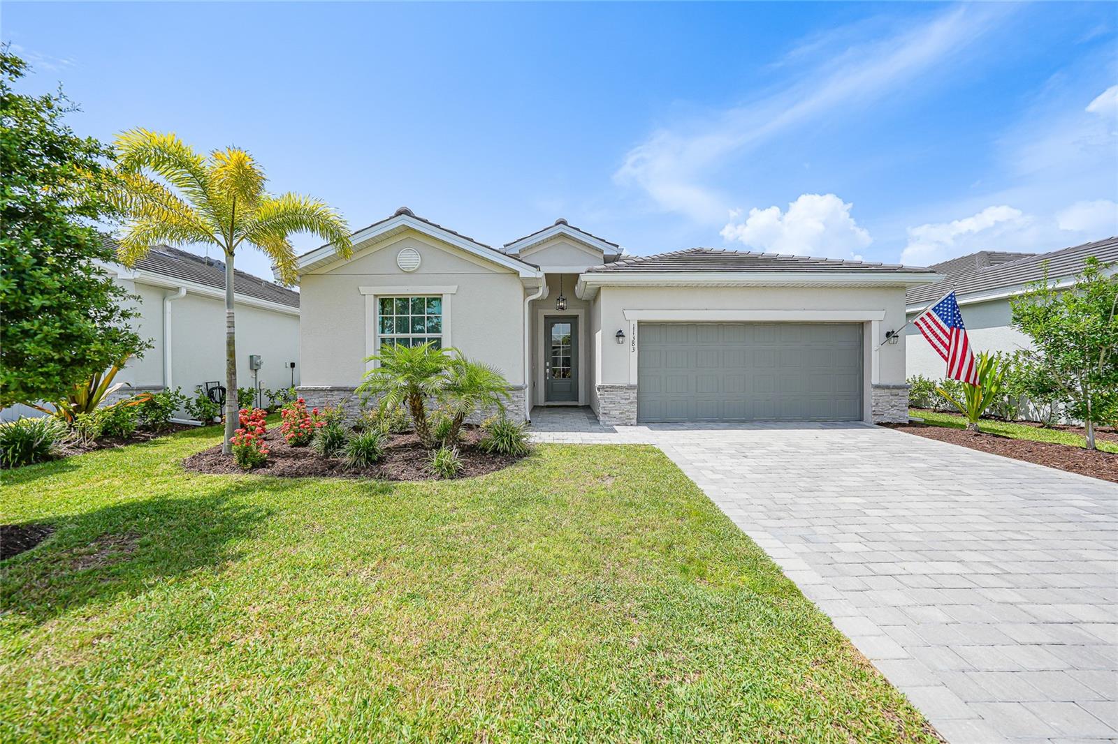 Experience the best of modern Florida living at 11383 Burgundy Drive, a beautifully constructed 2023 home located in the heart of the vibrant Wellen Park community. This meticulously designed 4-bedroom, 3-bath residence offers 2,035 square feet of thoughtfully crafted living space, all on one level—ideal for families, retirees, or anyone seeking a comfortable, open-concept lifestyle. The smart split-bedroom floorplan ensures privacy for guests or multigenerational living, while soaring ceilings and ceramic tile flooring throughout create an airy, modern feel. Recent upgrades include elegant new lighting fixtures and chandeliers throughout the home, a whole-house filtered water treatment system, and all decorative window treatments included for a move-in-ready experience. The chef-inspired eat-in kitchen is a true centerpiece, featuring a large island, stone countertops, upgraded cabinetry, walk-in pantry, and stainless-steel appliances. Step outside into your private retreat: an extended, fully enclosed screened-in lanai with a brand-new 6-person spa and tranquil pond views, perfect for relaxing evenings or entertaining under the stars. The fenced-in backyard offers both privacy and space for pets or play, with ample room to add a custom pool or outdoor kitchen if desired. Enjoy year-round comfort and peace of mind with hurricane-impact windows and doors, smart-home technology, energy-efficient systems, and an epoxy-finished two-car garage. Sliding glass doors connect indoor and outdoor living spaces seamlessly, enhancing the home’s easy flow. Situated on a beautifully landscaped lot in a quiet, gated, and deed-restricted community, this home also benefits from low-maintenance living with an HOA that includes lawn care, cable, internet, and irrigation. Wellen Park is known for its vibrant town center, boutique shopping, waterfront dining, outdoor concerts, and easy access to walking trails, conservation areas, parks, and beaches. You're just minutes from downtown Venice, the Gulf of Mexico, and major highways, with the Atlanta Braves Spring Training stadium right around the corner. Turnkey and move-in ready, 11383 Burgundy Drive offers the perfect blend of modern upgrades, flexible living, and the best of the Florida lifestyle.