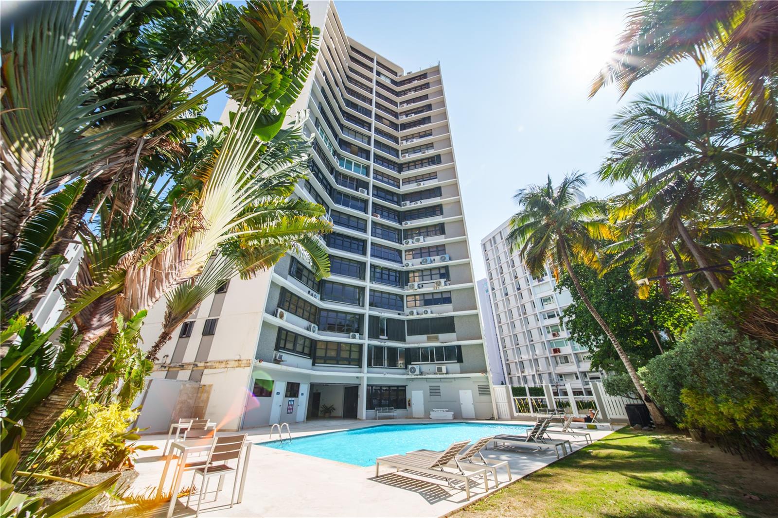 You found it. The best unit in Playa Grande. The current Owners Outdid themselves with this apartment, and it shows. I challenge you to find a better remodeled apt in the Playa Grande. From the oversized tile to the waterfall kitchen island, this condo exudes class. If you don't believe me, call me or text me and see for yourself... but buyer beware, you will end up making an offer after a quick private tour. For those not in the know of the Playa Garden experience. Playa Grande is the VIBE of Casual Beachfront Luxury in Condado, San Juan, Puerto Rico. The lobby area with its tropical gardens delivers a soothing welcome. Whether you pick up the kids from school or come home from a long day at the mines, you feel like you're on vacation every time you arrive. Walk every day on the Best beach of all, San Juan, with the largest Sand bank and turquoise blue water of any in the area. Relax and have BBQ parties by our beachfront heated pool and backyard. We are also located just a brisk walk away from multiple restaurants, gyms, and shops. We also have a full backup generator.