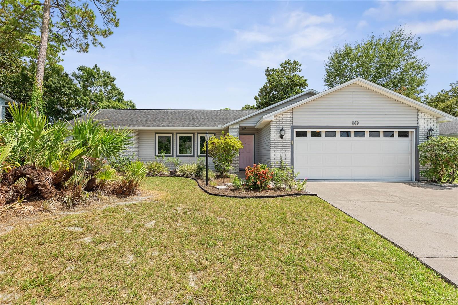 This one could be the right one for you. Located in a highly desired neighborhood & school district come see what this home has to offer. As you enter enjoy a spacious family room with vaulted ceilings enhanced with plentiful windows and natural light. Kitchen has all new stainless steel appliances and plenty of cabinet space with pantry. Off of the kitchen is a great seating area to enjoy your meals and entertain. Enhance your day with the wood burning fireplace or relax on your covered patio area admiring your lush landscaped backyard paradise. Fenced in yard for added privacy. Easy to care for wile tile flooring throughout. Larger primary bedroom with walk-in closet. Nice sized additional bedrooms. Large garage for parking and storage with side door access. Roof 2018, HVAC 2019, water heater 2018. Established homes on the street so no building surprises. Shopping and schools nearby. Sandy beaches only 15-20 minutes away. Plenty of convenient shopping within a few miles. Easy access via I-95 and US1 to St. Augustine, Daytona Beach and Orlando. Don’t miss out on this opportunity. Schedule a showing today!