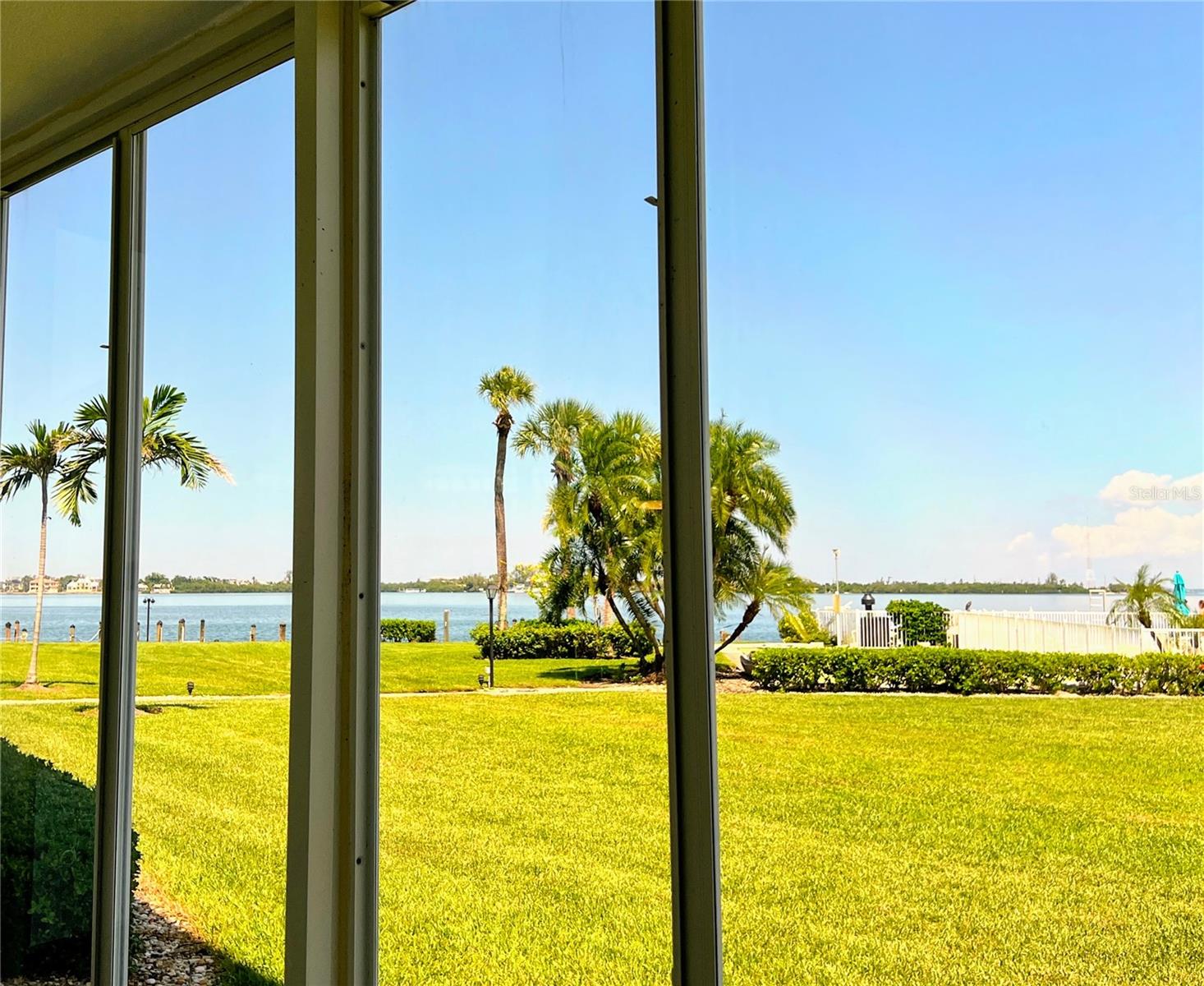 Direct Waterfront, newly updated 2 bedroom 2 bath end unit with hurricane resistant windows and sliders. Sarasota Harbor East, a premier 55+ maintenance-free community in one of the most desirable bayfront locations in Sarasota! Just minutes from downtown Sarasota, St. Armands Circle, Lido Beach, and directly across from the Sarasota Yacht Club, this community offers an unmatched combination of convenience, charm, and waterfront living. This residence features a fully glass-enclosed lanai—perfect for soaking in the spectacular waterfront views. The unit also comes with a covered parking space plus ample guest parking. Community highlights include: Free boat docks for sailboats or powerboats up to 30’ (first-come, first-serve), heated waterfront pool with stunning bay views, community gas grill and picnic area, secured covered bicycle shed & kayak storage, individual storage bins for residents. With its unbeatable location, Sarasota Harbor East is a rare opportunity to own in one of Sarasota’s most sought-after waterfront communities.