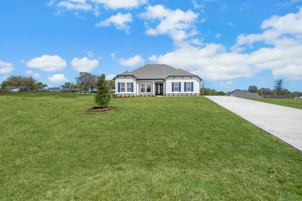 Photo of 3840 Saddle Hill Trail, Fruitland Park, FL 34731 (MLS # TB8535507)