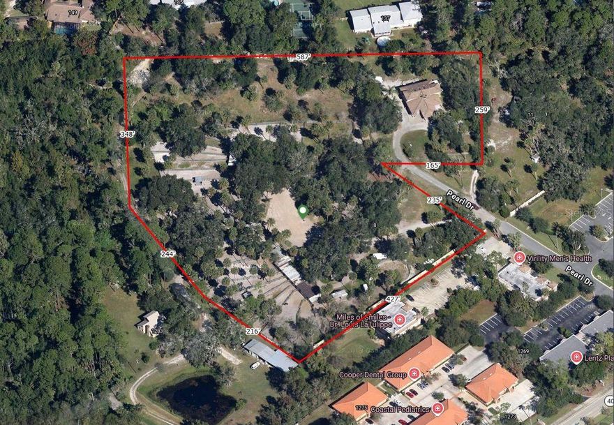 Located in the heart of Ormond Beach, this 3 bed 3 bath home on 7.2 acres offers a well-designed floor plan with inviting living spaces and great natural light throughout. On a peaceful street, this home provides easy access to beaches, parks, shopping, dining and minutes to both I-4 and I-95. Whether you’re looking for a primary residence, second home, or investment opportunity, this property delivers convenience, comfort, and classic Florida charm. With this location it's an easy walk to Publix, Starbucks and other restaurants. No need to drive! Possible rezoning would provide endless opportunities.