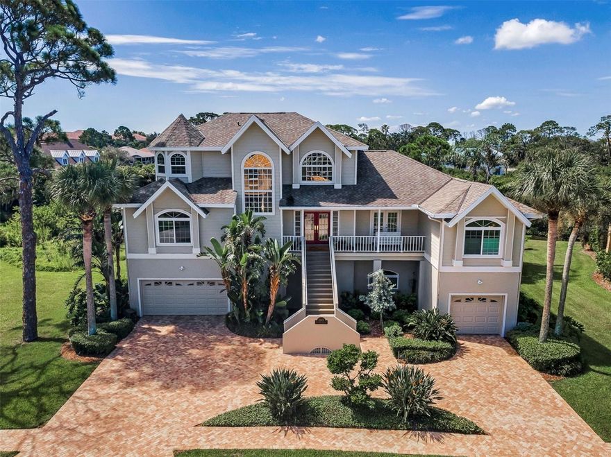 Waterfront Luxury in Harbour Watch – Resort-Style Living in Tarpon Springs. 

Welcome home to 2103 N. Pointe Alexis Drive, an exquisite coastal home in the exclusive gated community of Harbour Watch. This tropical retreat offers panoramic water views, lush landscaping, and the relaxed elegance of a private resort—all just minutes from downtown Tarpon Springs, and Gulf beaches. 

Step inside this meticulously updated coastal home featuring PGT WinGuard impact windows/sliders, a whole-house generator, and remodeled kitchen and baths. Nearly every room showcases stunning water and nature views.
The chef’s kitchen offers a gas range, pot-filler, warming drawer, oversized island, stainless appliances, and coffee/wine bar with built-in wine fridge—ideal for entertaining. The main floor includes three spacious bedrooms, all with custom built-ins. 
Upstairs, the private primary suite offers a sitting area, balcony with water views, dual walk-in closets, and a spa-style bath with soaking tub, floating vanities, and walk-in shower. 

Outdoors, enjoy a heated saltwater pool, screened lanai, and direct access to the Gulf from your floating dock via mangrove waterways. Elevated construction and ground-level bonus space and storage provide room for all your coastal lifestyle gear. 

Community amenities include a clubhouse, pool and spa, tennis/pickleball courts, Gulf-front pier, playground, butterfly garden, and 24-hour gated security. 

Recent upgrades: PGT impact windows & sliders (2017), roof (2017), generator (2018), AC units (2014 & 2017), water heater (2022), exterior paint (2025), pool pump/heater/platform (2025). Clear 4-point inspection, transferable flood insurance and roof warranty. 

Live where others vacation - your Florida waterfront lifestyle awaits.