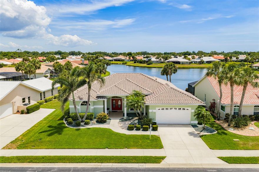 BEST LAKE VIEWS IN WATERFORD! Spacious 3 bedroom, 2.5 bath, 2-car garage waterfront pool home located in friendly gated community!  New A/C and pool cage in 2025, pool resurfaced in 2021 and roof was replaced in 2019. Meticulously maintained home features 2,176 sf of living area, high ceilings, large windows for an abundance of natural light, formal dining area and formal living room with large pocketing slider to lanai. Light and bright kitchen offers granite counters and backsplash, center island, convenient pass thru window to lanai, closet pantry, casual dining area with aquarium window -all overlooking family room with huge window to enjoy the lake views. Split floor plan provides privacy for all featuring generous primary suite with access to pool and private bath with dual vanities, jetted tub and walk-in shower plus there are two guest bedrooms with extra storage above closets and separate full bath. Step outside to a covered lanai and 30’ x 15’ screened pool with outside half bath and true southern exposure so guests from the north can enjoy an abundance of Florida sunshine. Grounds are nicely landscaped for impeccable curb appeal.  The Waterford Sports Club offers low HOA fees and includes clubhouse, fitness center, library, heated Olympic-size pool, heated spa, tennis, serene park, social events plus yearly and seasonal memberships are available at the 27-hole Championship Golf Course.  Great location with easy access to I-75 to commute north or south, restaurants, shopping, schools and a short drive to Venice beaches. Don’t miss this opportunity! Schedule your private showing today!