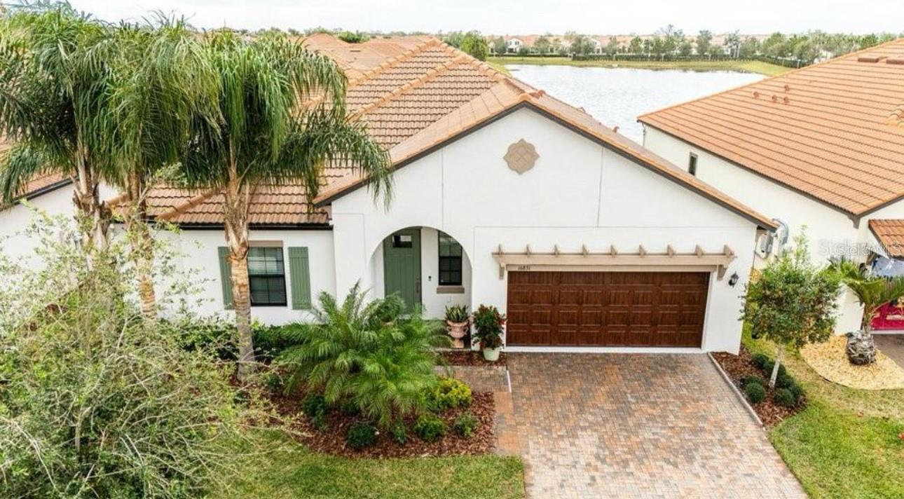 Lennar Lagoon 55+ Medley Community. 2302 SF Living Area, Bonus Storage Room Above Garage. Lennar Ardent Model, Very Open Floor Plan with Kitchen, Dinning, Family Room Combo. Huge Oversized Screened Lanai Overlooking The Pond. Upgrades Include: Ceramic Tile Throughout, Crown Molding, Granite Counters, Wood Cabinets, Large Pantry. Medley Club Access with Restaurant, Six Pickelball Courts, Huge Pool, Complete Gym, Two Ball Rooms for Rental. Shows and Live Music every Weekend. Great Place to Settle.