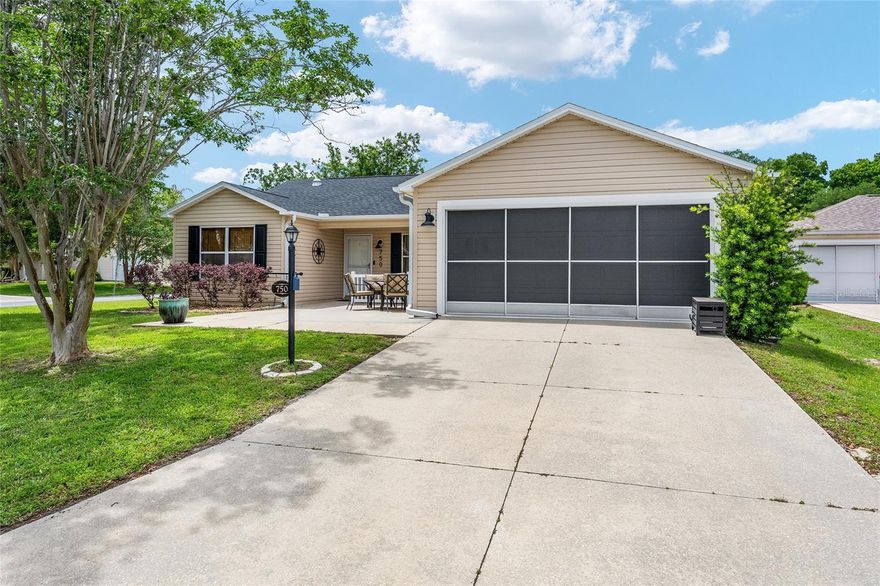 Welcome home to this beautiful pool home on an oversized corner lot in The Village of Lynnhaven. This 3/2 Amarillo model was renovated in 2021 with a new roof, water heater and a trane HVAC (2019). As you drive up, you will notice the beautiful landscaping and the lovely front porch. As you enter the home, you will notice the high knockdown ceilings and the newly painted walls. This is a very popular split floorplan. The kitchen has stainless appliances, a beautiful backsplash and honed granite countertops with tile flooring. The en-suite bathroom in the primary bedroom has new tile flooring, a renovated shower and dual raised sinks. Both of the guest bedrooms have closets and laminate flooring. You will notice the stunning oil rubbed bronze light fixtures and a multi blade fan in the main living area. Through the glass sliders near the dining area, you will see the beautiful L-shaped pool, all enclosed with a spacious birdcage. The Tiki Bar stays as well as the bar stools. The laundry is located inside the home and there is a 2 car garage. This quiet village in Lynnhaven is only a few minutes from Lake Sumter Landing. Taxes $3,192.35, Maint $380.32, Fire $320.71 and Annual Bond Payment $810.05. Bond Balance $4,883.30.