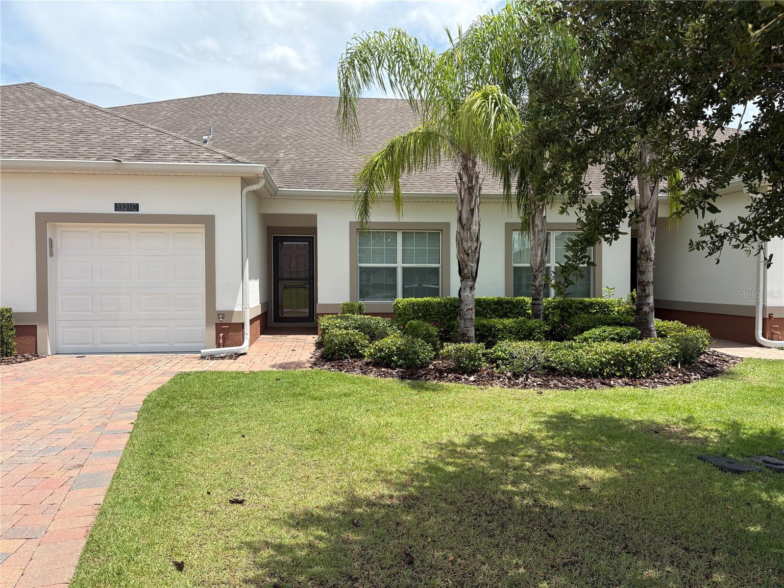 ***HERITAGE HILLS ACTIVE ADULT COMMUNITY***This 2018, 2 bedroom, 2 bathroom plus den/office is very well appointed with lots up upgrades. From the foyer, the gorgeous wood-look tile takes you to all the living areas, with the exception of the two bedrooms. The split bedroom floor plan allows for privacy with the guest bedroom having an ensuite with shower/tub and also having access for guests with another door off the foyer. The kitchen has a breakfast bar, upgraded Profile GE SS appliances, upgraded pendant lights, tile back splash, quartz countertops and is open to the family room, dining room and the flex/office area. The spacious primary bedroom features a very large walk in closet! The primary bath has a dual sink quartz countertop vanity and walk in shower. The outdoor living area has been expanded with a screened cage with pavers that measures 30'x13' where you can relax and enjoy the the unobstructed green space with no rear neighbors. The front door has a glass/screen storm door to enjoy the natural light. There is crown molding in the family room, foyer and master bedroom, and a nest thermostat and ring doorbell that stay. Hunter Douglas Duet pleated shades throughout the home. The garage features hanging storage racks and laundry room has cabinets for storage! Heritage Hills amenities include a heated pool and spa, pickle ball and tennis, bocce and shuffle board, putting green, basketball courts, fitness room, aerobics room, craft room, card room, library, billiard room, golf simulator and ballroom and so many organized activities, exercise classes & events. There is a 5 mile walking trail around the community and guard gated access. Heritage Hills located in the very popular city of Clermont, FL, where you can find all of one's daily conveniences, including shopping, dining, Orlando Health hospital, Costco, most of the main car dealerships, two access points to pick up the Florida turnpike and only 20-40 minutes from Orlando, all the theme parks, airports and so much more.***SELLER IS GIVING THE BUYER 2 ANNUAL DISNEY INCREDI-PASSES FOR THE 4 DISNEY PARKS OR 2 ANNUAL UNIVERSAL PREMIER LEVAL LEVAL PASSES AT CLOSING***