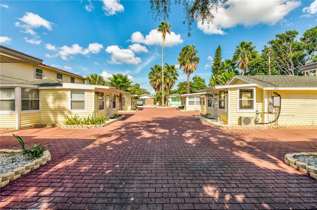 Welcome to The Cottages of Madeira Beach! This is the opportunity you've been waiting for - 7 amazing beach cottages on 3 lots Hotel/Motel, arranged in a quaint well maintained courtyard, a resort-style pool (heated in the winter) with spa jets, a privacy fence and comfortable lounge chairs as well as a nice BBQ area and Tiki Huts on site, a separate laundry room. This little slice of paradise is only steps from beach access to the sugar sandy beaches of the marvelous Madeira Beach and just 1 block north of Famous John’s Pass Village with Restaurants, Shopping, Live Entertainment, Water Sports, Sightseeing Boat trips, Fishing, and Dolphin Sightings from the Boardwalk. All beach cottages have been meticulously updated and come fully furnished. Brand new roofs too! These cottages are on track to do OVER $300k this year and are booking up quickly. This property is truly turn key and ready to help make your dreams come true!