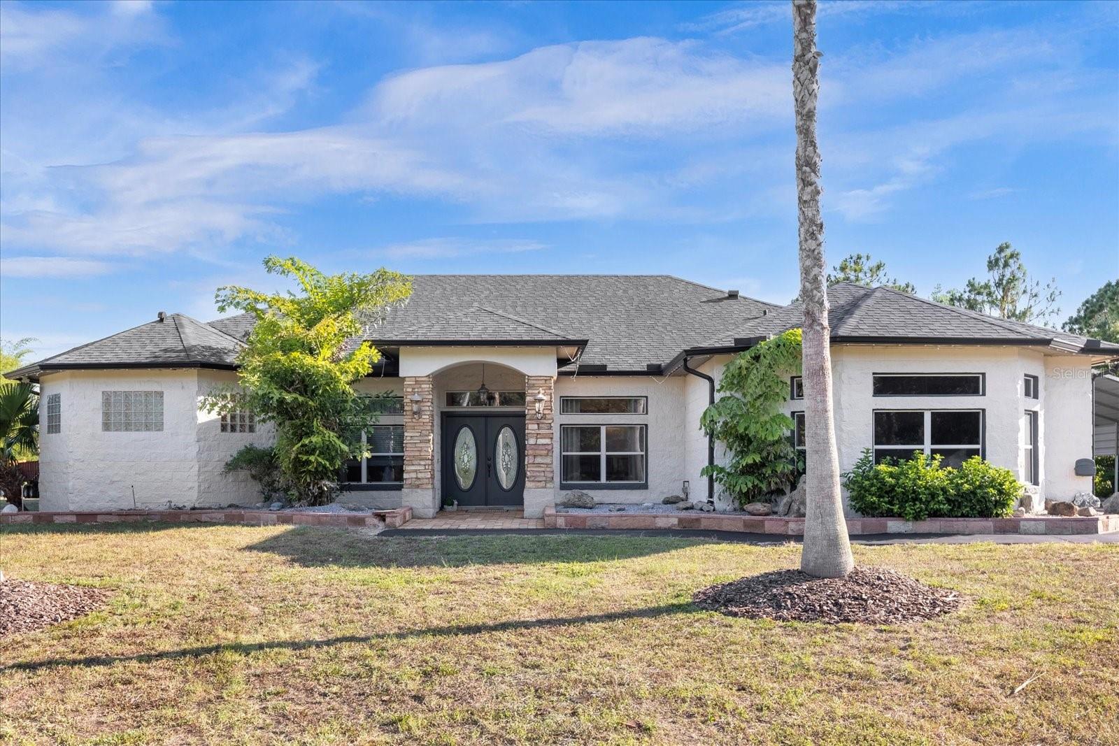 Nature lovers’ paradise! Enjoy country lifestyle and privacy with this beautifully, well-maintained property located at 2975 West Osceola Rd, Geneva, FL 32732, (Unincorporated Seminole County). Enjoy the rural charm of Geneva, while enjoying the proximity to modern conveniences, top-rated schools, quaint local amenities, as well as all the action that Sanford, Oviedo, Beaches and Central Florida offers. This is a partially furnished, custom-built single-family home that sits on 7.99 acres of land. House is ~3,250 SF, with ~2,200 SF of HVAC. This concrete block home has a 2-way split floor plan on a single level, with 4 bedrooms and 2 baths. Double paved driveways with electric gates, will bring you to the double door entryway that opens up to a foyer and dining room. Dining Room is able to accommodate a large table to comfortably host family gatherings. Vinyl flooring throughout the house with lots of windows and doors to let the natural light in. The kitchen is spacious with a reading/coffee nook, stainless steel appliances, island, quartz countertops, backsplash and walk-in pantry. 8ft Pella French Doors open to pool deck. Living Room has ample seating with an electric fireplace and 8 ft sliding doors open to pool deck. The primary suite is a luxurious retreat with 8ft French Doors opening to the pool deck. The primary bathroom features dual sinks, and a large separate glass rainfall shower, private toilet and jetted jacuzzi tub, with two separate walk-in closets. There are 3 additional bedrooms and 1 additional bathroom on the opposite side of the home (1 bedroom is currently being used as an office and 1 bedroom is currently being used as an exercise space). Enjoy indoor / outdoor living with a large, covered patio and screened inground salt-water pool. Perfect for your days of relaxation. Extras: Property has City Water (no well), No HOAs, 1 Car Garage, 2 Car Car-Port, storage shed (has electricity and water), Chicken Coop, Boat Shed and Pond. 6 Mins from kings landing Publix, wawa. 5 mins to the iconic St. John’s River boat ramp;10 mins to Sanford Airport; 20 mins to UCF; 30 mins to Beaches, Attractions and Orlando International Airport. Close to major roads like CR- 426, SR-46; SR-415, I-95, I-4, and HWY 417. Roof done in 2019 and HVAC replaced in 2020. Bring your Boat, RV, ATVs, there is plenty of space for all of your toys. Call or email today for your private showing!