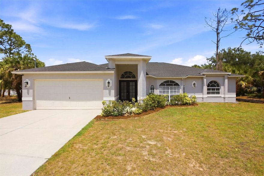 HOUSE FULLY FURNISHED. Currently operated as a short term rental. Beautiful, fully remodeled one level home on a double lot. Brand new 2023 Appliances, AC, Heater, water heater, sinks, roof, well, toilets, doors, paint, etc. Large 3 bedrooms, 2 baths and a 2 car garage! This spacious split-bedroom floor plan is perfect for those who love to entertain. The double lot offers close to a half-acre of privacy, making it the ideal oasis for those seeking peace and quiet. As you step inside, you'll be greeted by vaulted ceilings that provide an open and airy feel to the home. The master bedroom has a walk-in closet, dual sinks, soak tub and a double shower. Other great features of this home include a large inside utility room, double sinks in guest bathroom and a screened lanai watching the wildlife. The home is conveniently located close to I-75, shopping, and dining, making it the perfect place to call home.
