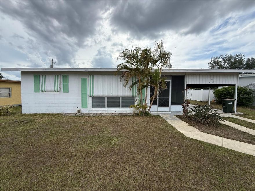 Well-maintained 2-bedroom 1-bathroom BLOCK home is ready to move in. FRESHLY PAINTED * NEW KITCHEN * Central AC * Roof replaced in 2017 * Separate laundry room * Large screened-in lanai with a work/storage room * Covered carport. This home is perfect for seasonal, downsizing or first-time owner. Minutes to the North Port Aquatic Center, the water park that features a 25-meter stretch pool, three slides, and a lazy river. Conveniently located, this home provides easy access to key areas including Wellen Park, Venice, Port Charlotte, and Englewood. Nearby amenities include shopping centers, hospitals, schools, the Morgan Family Center, and the North Port Aquatic Center.