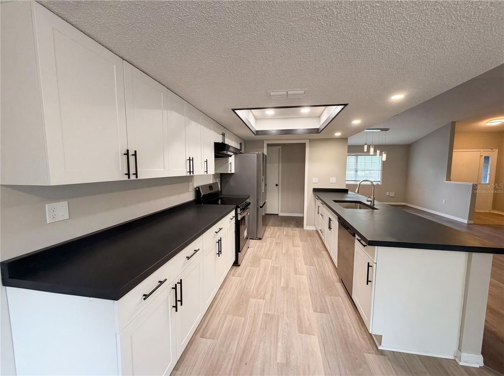 Photo of 7650 Holiday Drive, Spring Hill, FL 34606 (MLS # O6398236)