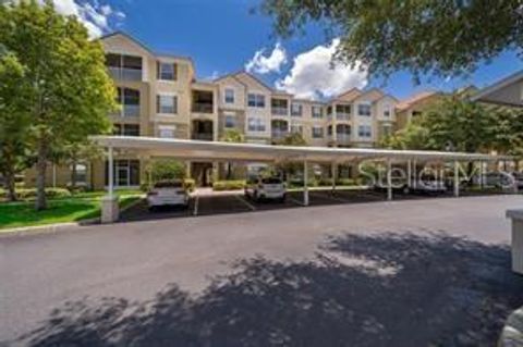 Photo of 3344 Robert Trend Jones Dr #202, Orlando, FL 32835 (MLS # O6390503)