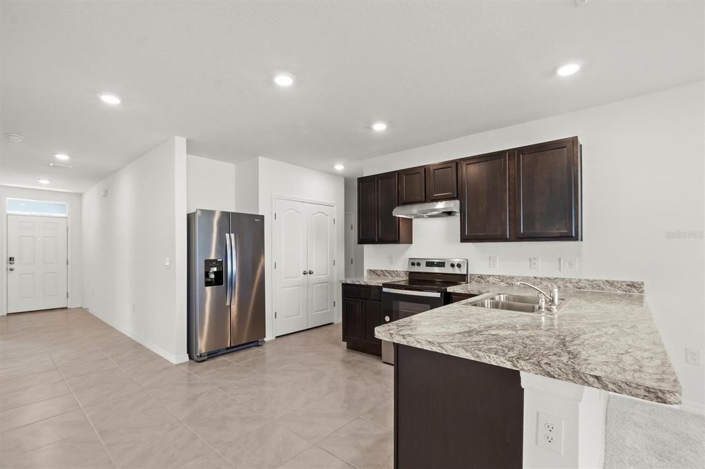 Photo of 451 Boardwalk Avenue, Haines City, FL 33844 (MLS # TB8451435)