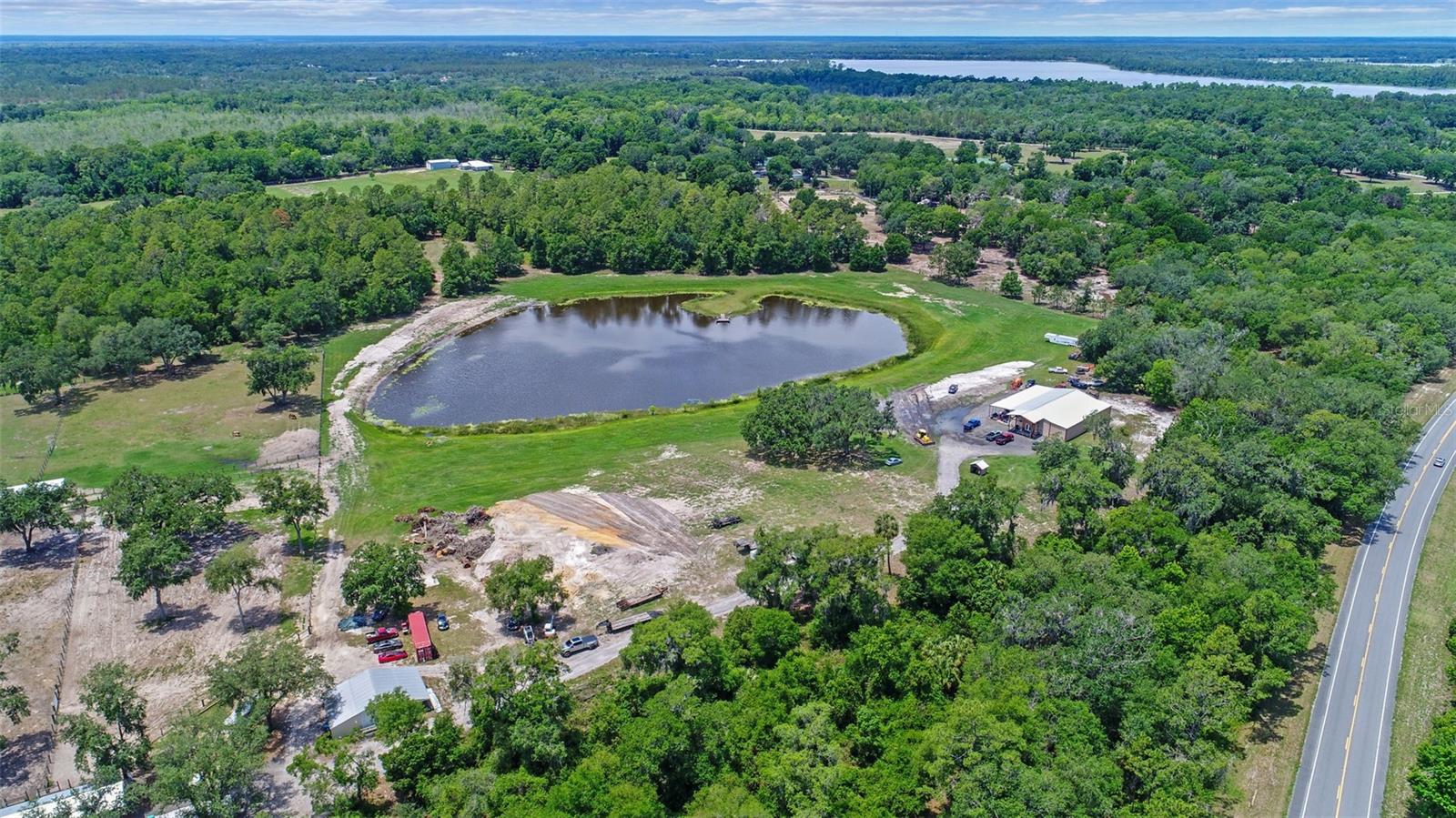47-Acre Equestrian & Multi-Use Estate in DeLeon Springs, FL – Ponds, Pastures & over 9500 square feet of Infrastructure.
Welcome to a rare and remarkable 47-acre estate in the heart of DeLeon Springs, Florida—perfectly suited for equestrian living, agricultural use, recreational retreat, or multi-purpose development. This versatile property features extensive infrastructure, beautiful natural elements, and agriculture and forestry exemptions.
Key Features Include: New Built Horse Barn (49’ x 47’) Built for functionality and ease of care; Six well-ventilated stalls; Separate tack and feed rooms; Wide overhang providing parking, extra shade and shelter.
Massive Workshop with Living Quarters (75’ x 80’): Fully air-conditioned interior, Three 12’ roll-up doors for equipment and vehicle access,
Built-in living quarters ideal for caretakers, guests, or weekend stays- Enclosed 15’ x 80’ storage room, Attached 20’ x 80’ lean-to for covered workspace or additional storage. 40’ x 80’ insulated area with spray foam – excellent for operations or storage requiring climate control.
Additional Enclosed Building (30’ x 47’): Roll-up doors, ideal for secure equipment storage, hobby use, or additional workspace; Land & Water Features: Scenic 5 acres pond: stocked with bass, bream and catfish and frequented by ducks—perfect for fishing, wildlife viewing, or water recreation. The property is also home to whitetail deer and Osceola Turkeys. Three fenced pastures, ready for horses or livestock. Huge Live Oak and Pine trees throughout the property.
Forestry Agricultural exemption in place, offering significant tax benefits.
Three wells strategically located across the land.
This property combines beauty, utility, and potential in a peaceful, rural setting just minutes from area amenities. Whether you're expanding your equestrian operation, starting a homestead, or investing in versatile acreage with infrastructure already in place, this estate is a must-see.
Opportunities like this don’t come often—schedule your private tour today!