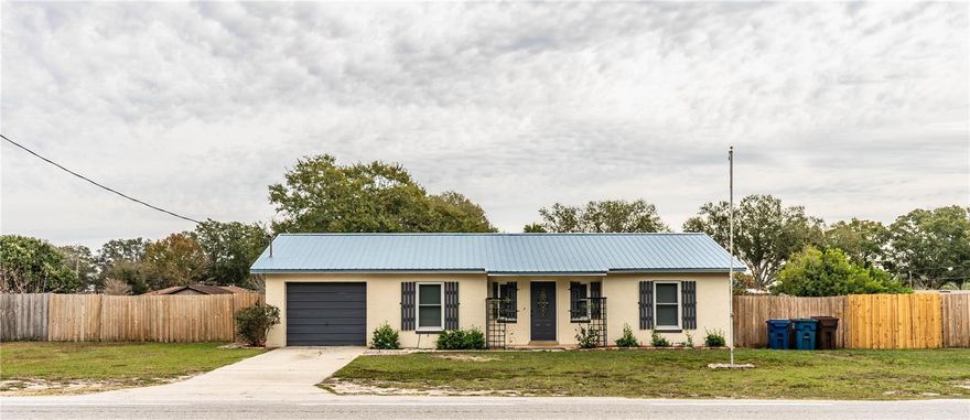 USDA Eligible. Welcome to 7058 Berkley Road, a move-in-ready 4-bedroom, 1½-bath home offering numerous recent upgrades, including a metal roof (2023), HVAC system (202022), tankless water heater (2025) and windows (2018).

Inside, the home features luxury vinyl flooring throughout, updated bathrooms with ceramic tile and stone countertops, and a functional kitchen with hardwood cabinetry designed for both everyday use and entertaining.

The exterior offers a large, fully fenced backyard with patio, ideal for outdoor living, pets, or gatherings.

Situated in Polk City, this property offers a small-town atmosphere with convenient access to nearby communities. Polk City is known for its peaceful residential setting, open spaces, and easy connectivity to larger employment and entertainment hubs. Residents enjoy proximity to I-4, making commuting to Lakeland, Tampa, and Orlando accessible. The area is also near local parks, schools, dining, and everyday conveniences, while maintaining a quieter, less congested lifestyle.

Move-in ready and centrally located—schedule your private showing today.