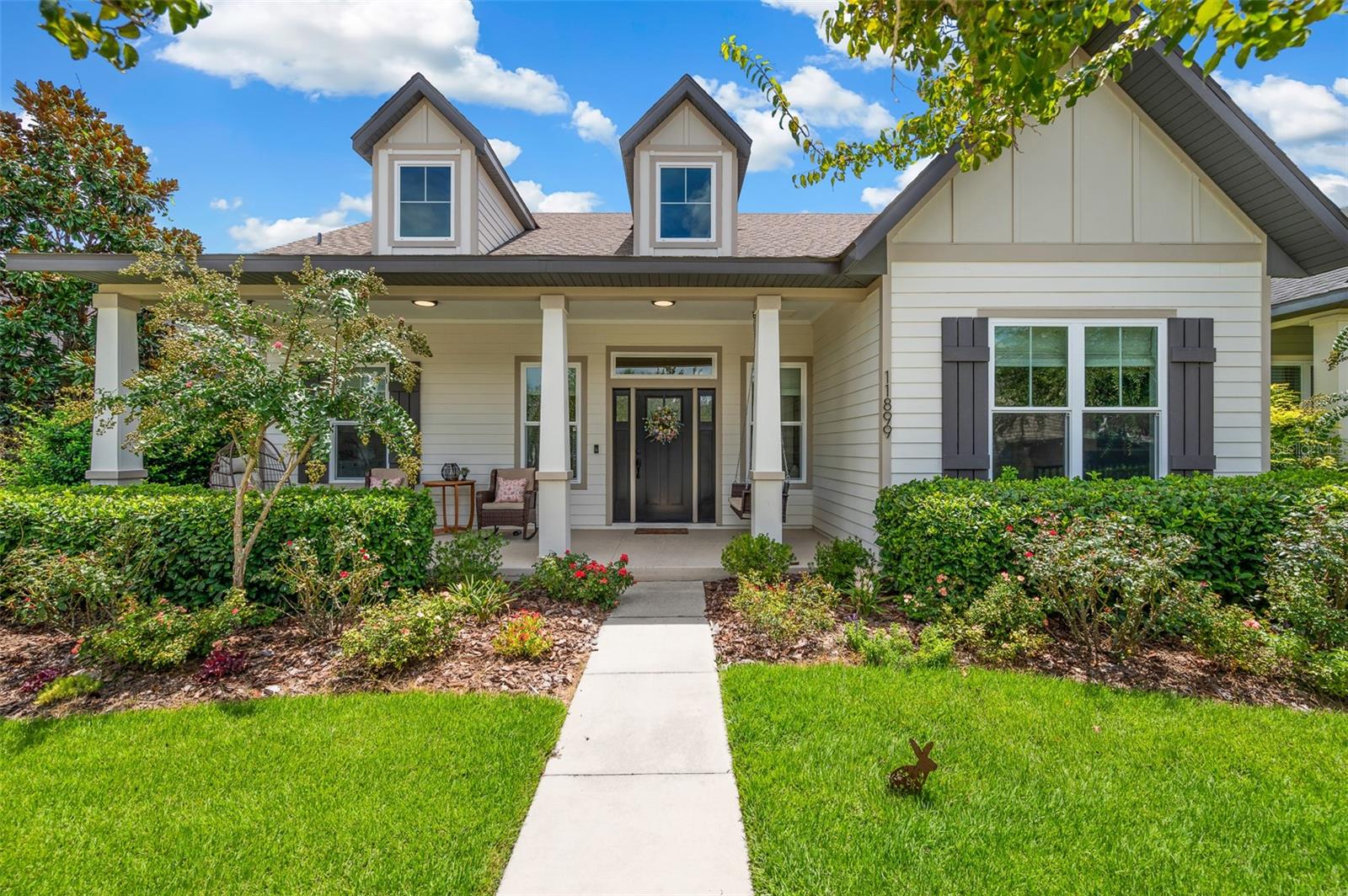 Welcome to this charming and energy-efficient 3-bedroom, 2-bathroom home built by renowned builder Tommy Williams Homes, nestled in the highly sought-after Oakmont neighborhood. Boasting exceptional curb appeal, this home greets you with a spacious front patio complete with a cozy porch swing and lush, mature landscaping. Step inside to discover bamboo wood flooring throughout, an open living area featuring custom built-in shelving with accent lighting, a tray ceiling, and a sleek electric fireplace—perfect for relaxing or entertaining. The thoughtfully designed kitchen shines with brand new quartz countertops and backsplash, stainless steel appliances, and a clear view of the dining area and FENCED IN backyard through elegant French doors. The generously sized primary suite is a true retreat, offering a large walk-in closet and a luxurious en-suite bath with double vanity featuring new quartz counters, a frameless glass shower, and modern bronze fixtures. Additional highlights include custom woven Roman shades and plantation shutters, designer light fixtures, and bronze plumbing finishes throughout. Built with energy efficiency in mind, the home features a NEW gas tankless water heater, NEW HVAC system, NEW irrigation system, advanced insulation, and solar panels for lower utility costs. Residents of Oakmont enjoy access to Gainesville’s premier amenity center, including a state-of-the-art clubhouse with fitness center and party room, resort-style pool with lap lanes and splash area, tennis and basketball courts, playground, and scenic sidewalks throughout the community. Don’t miss your chance to own this beautifully maintained and upgraded home in one of Gainesville’s most vibrant communities! Rated for top notch schools: Chiles Elementary, Kanapaha Middle and Buchholz High. Located convenient to Publix Market Square, Haile Plantation and Town of Tioga.
